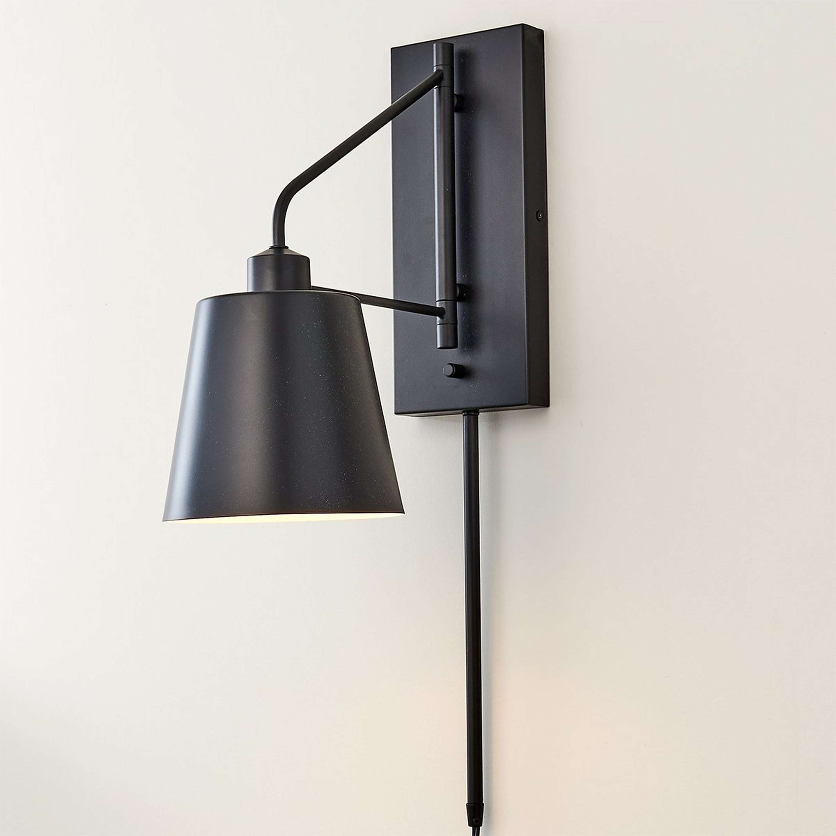 A Paulson Swing Arm Sconce with Matte Black color
