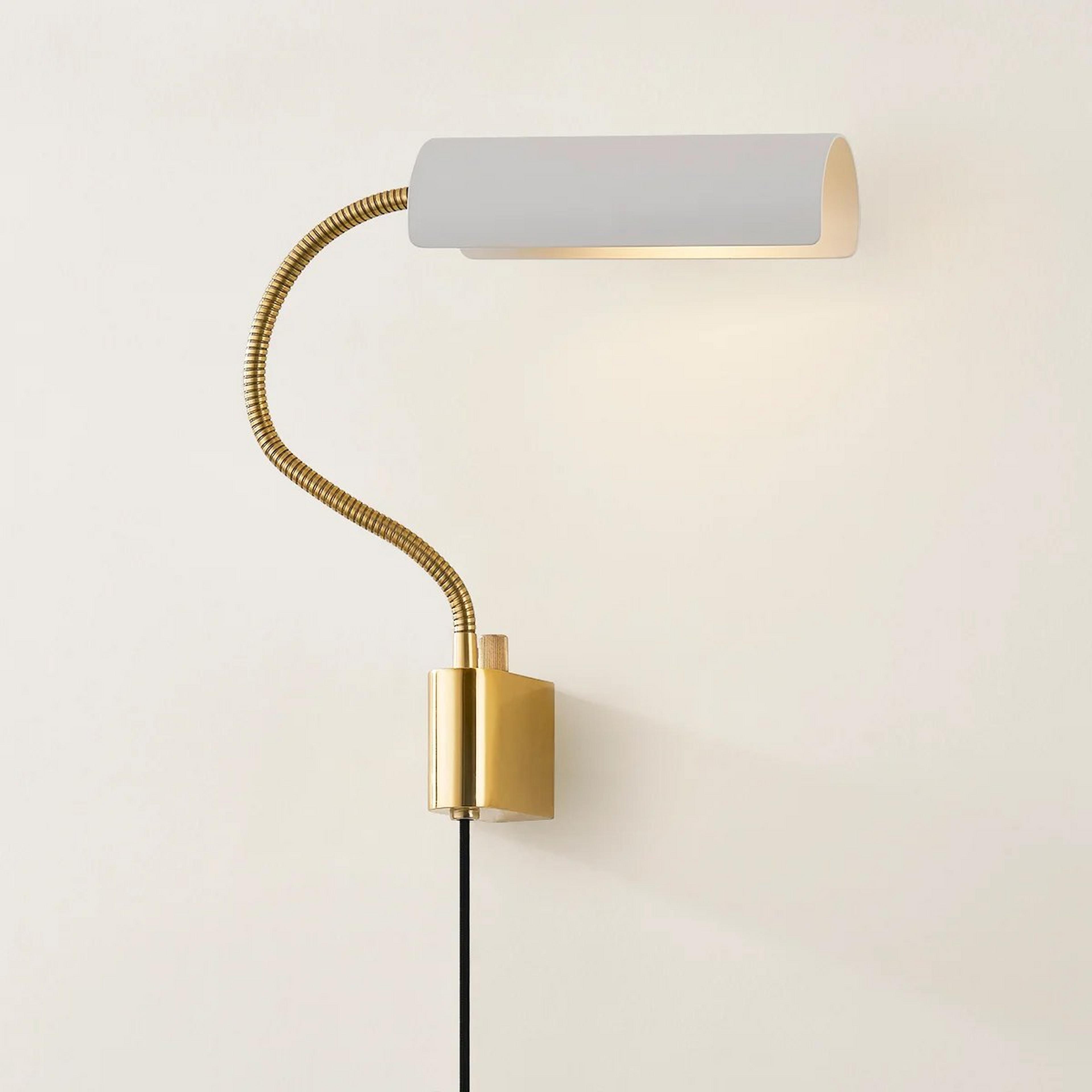 A Bjorn Swing Arm Sconce with Brass / White color