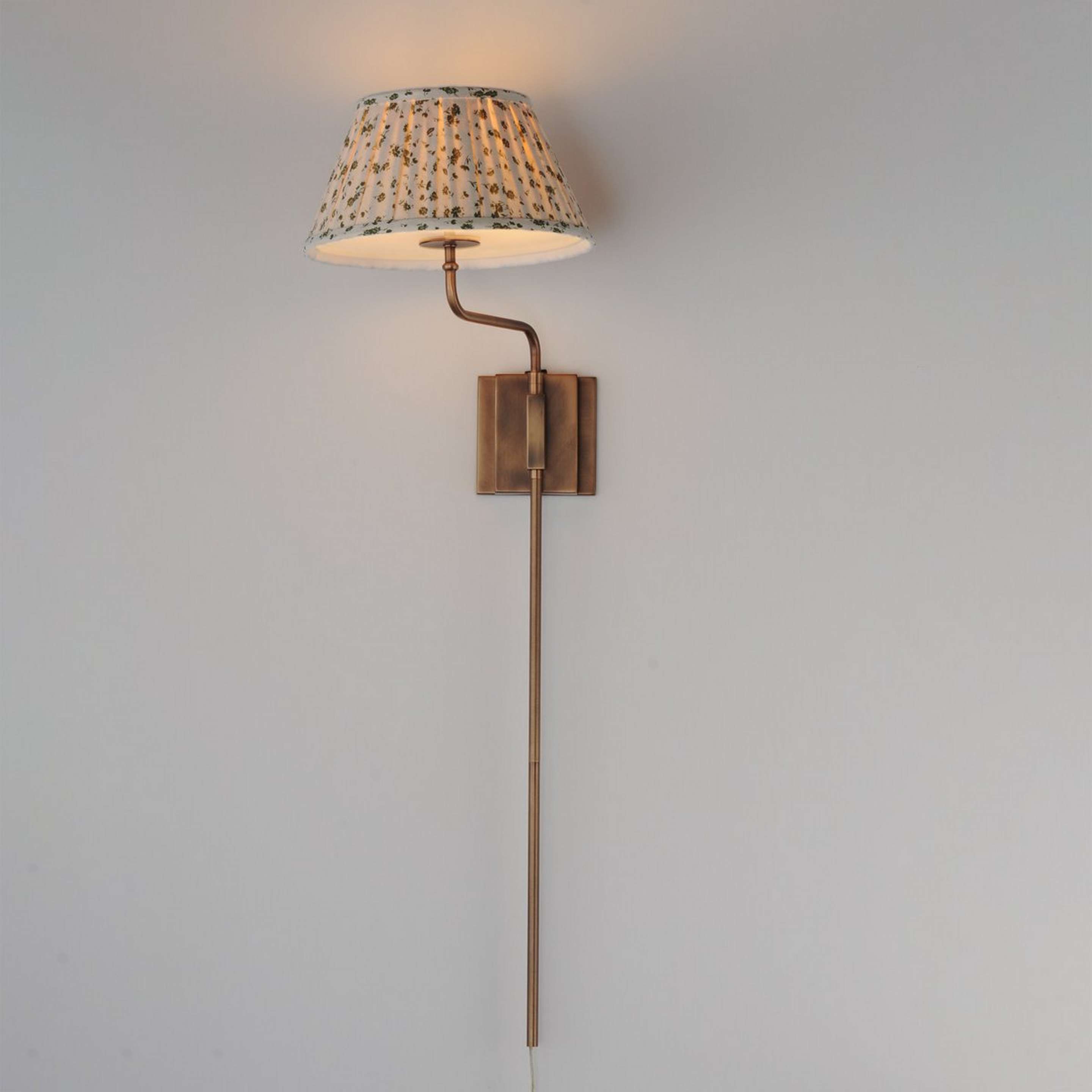 A Dezzie Plug-In Swing Arm Sconce with Brass / Green / White color