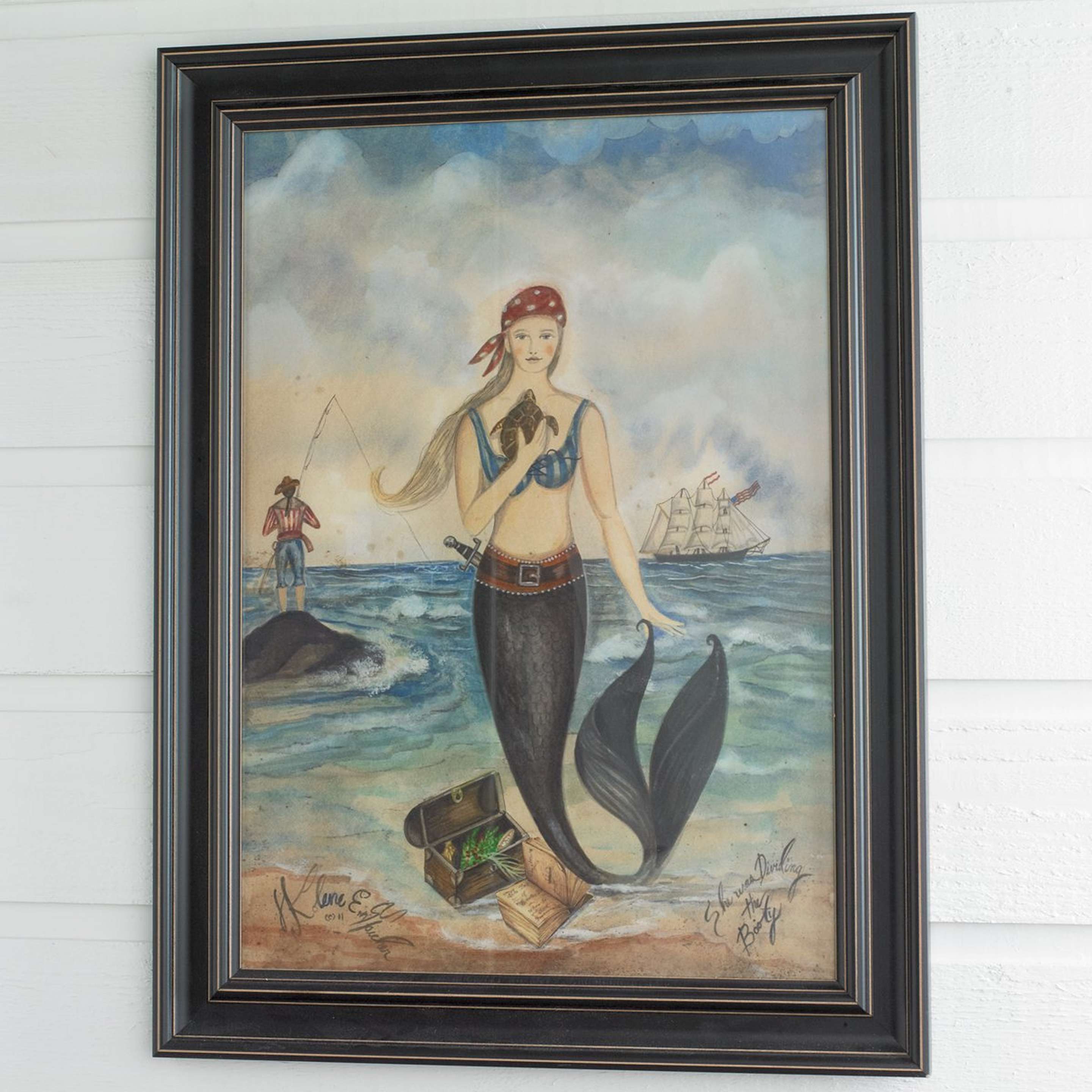 A Framed Mermaid Pirate Print with Multi color