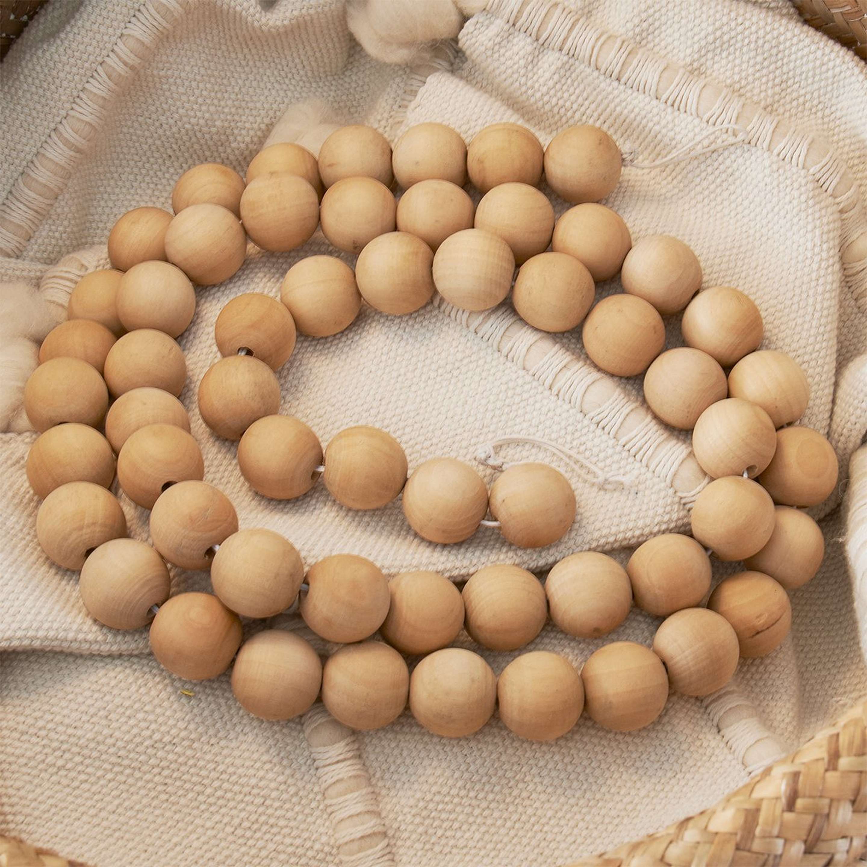 A 6' Long Round Wooden Bead Garland with Light Wood color