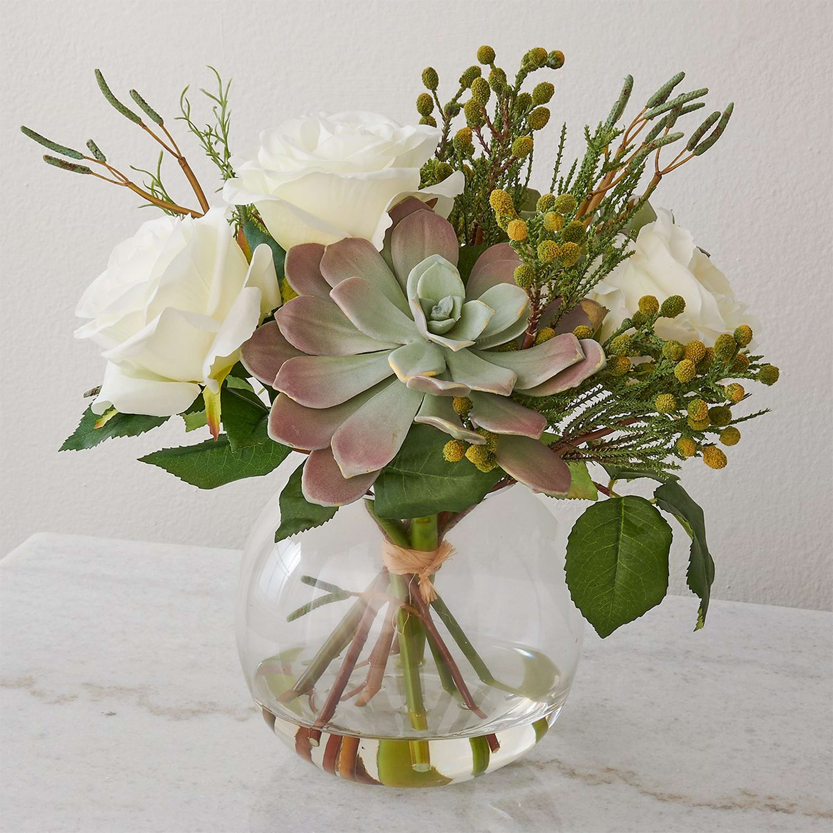 A Bertha Floral Centerpiece with Green / White / Clear Glass color