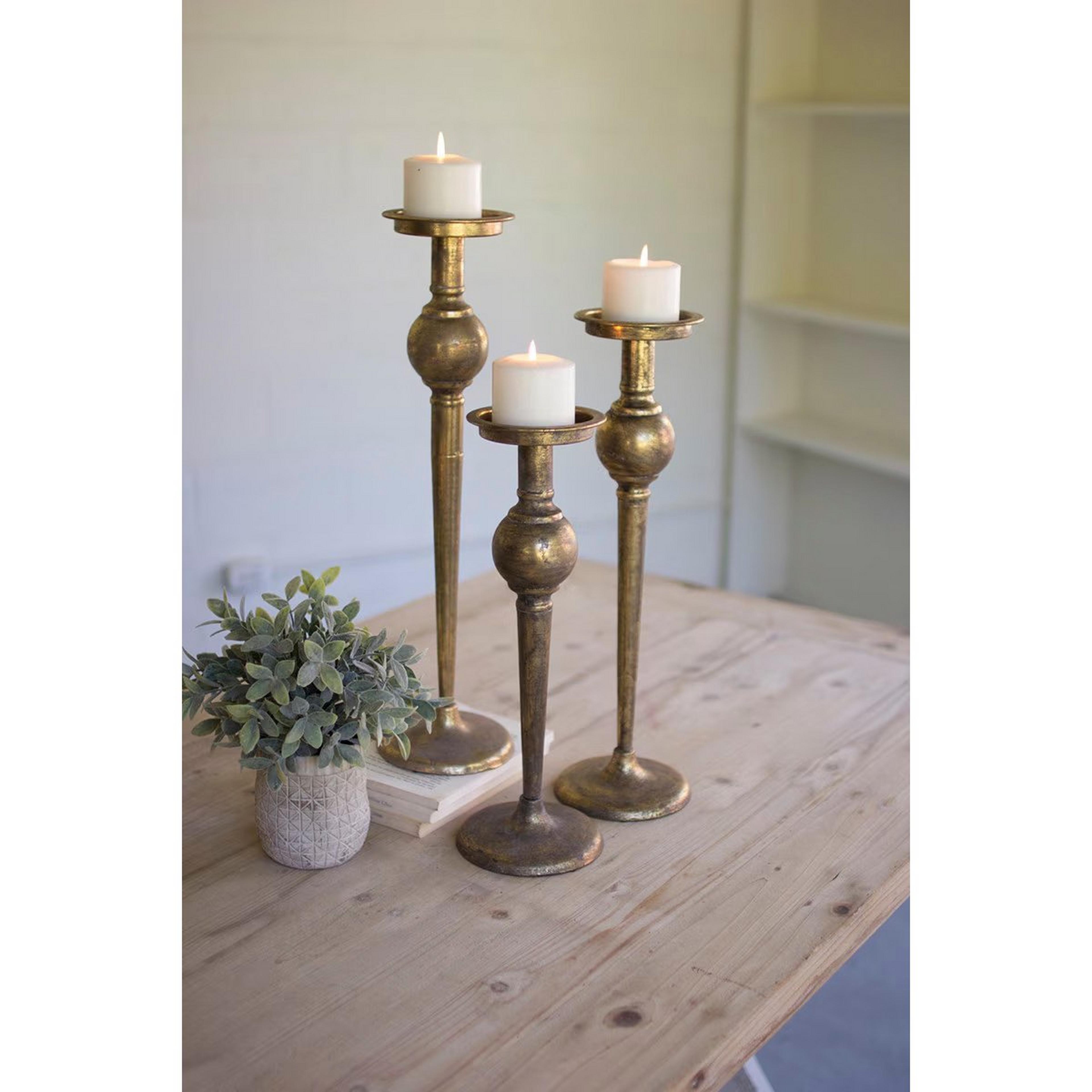 A Oreicha Candle Holders with Antique Brass color