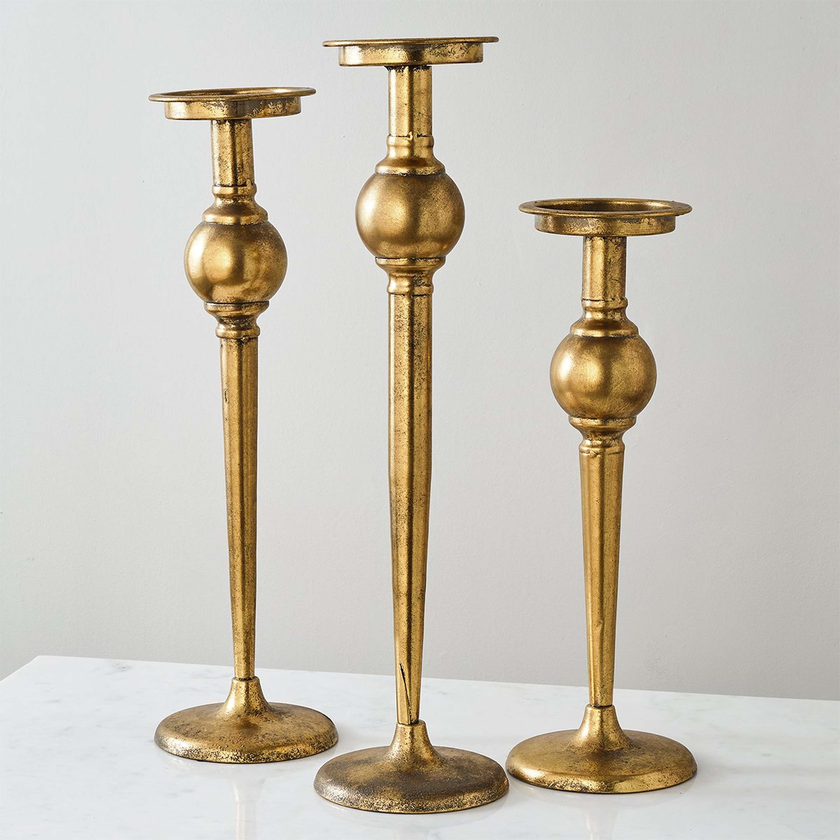A Oreicha Candle Holders with Antique Brass color