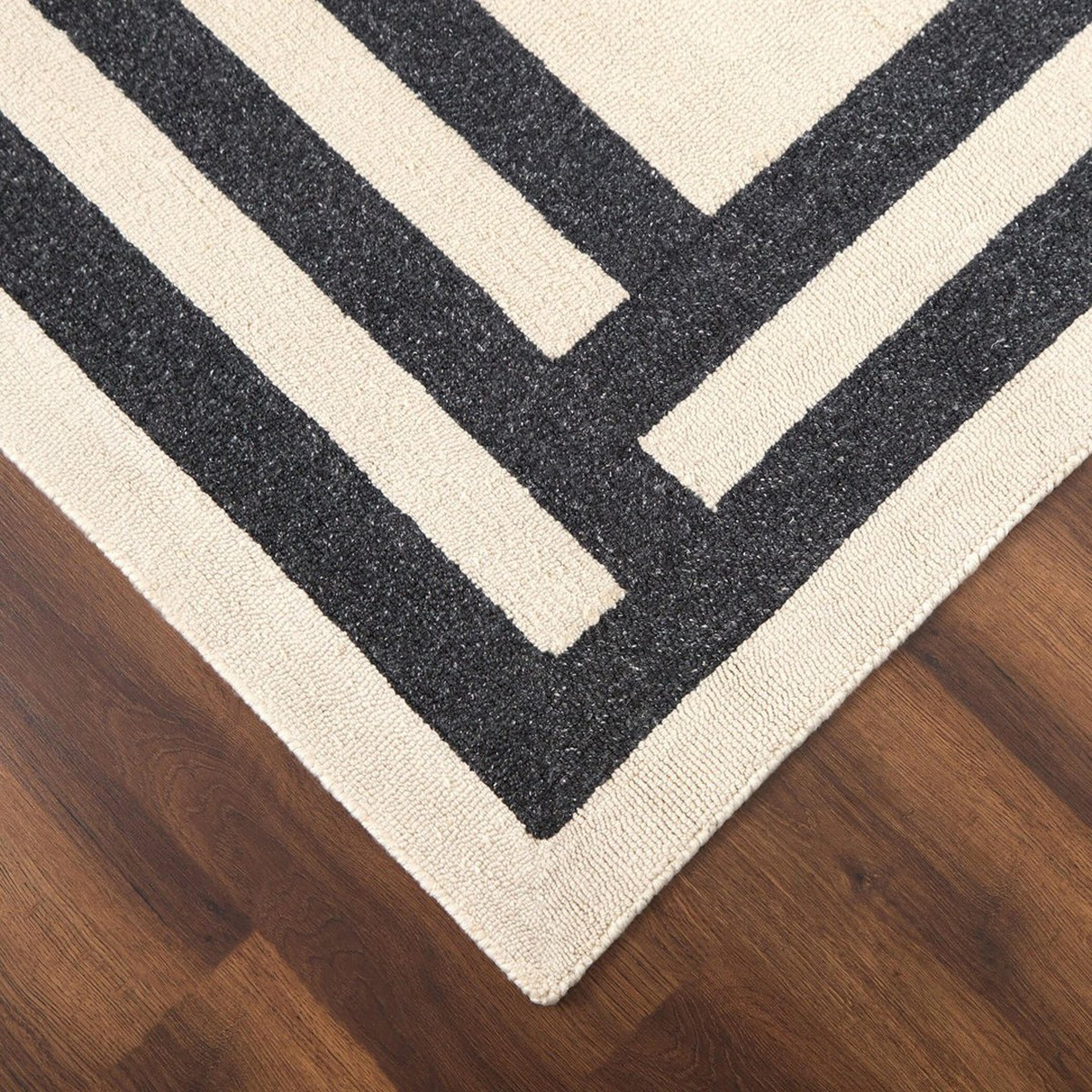 A Angola Hand-Hooked Indoor/Outdoor Rug with Ivory / Black color