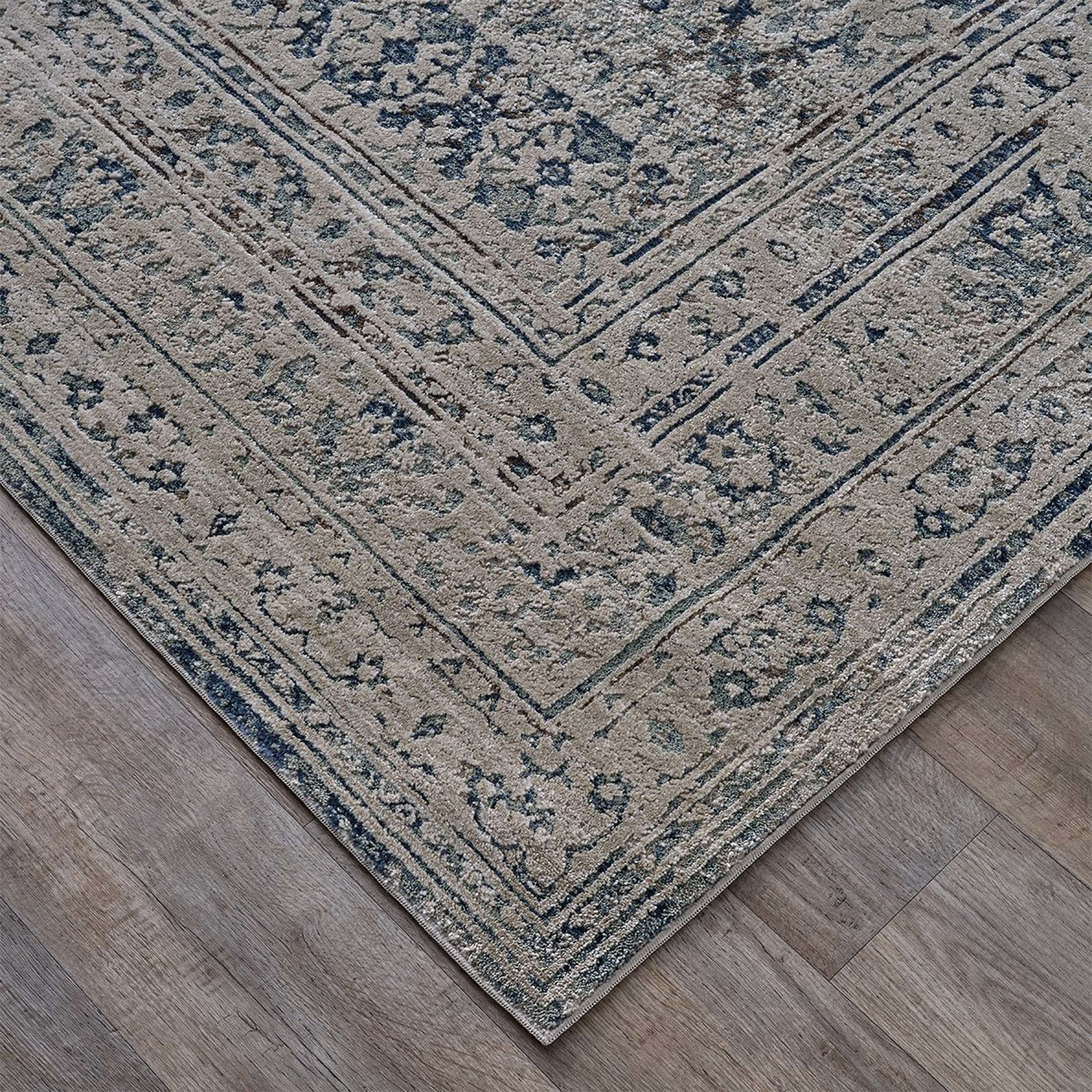 A Vessant Rug with Gray / Blue / Taupe color