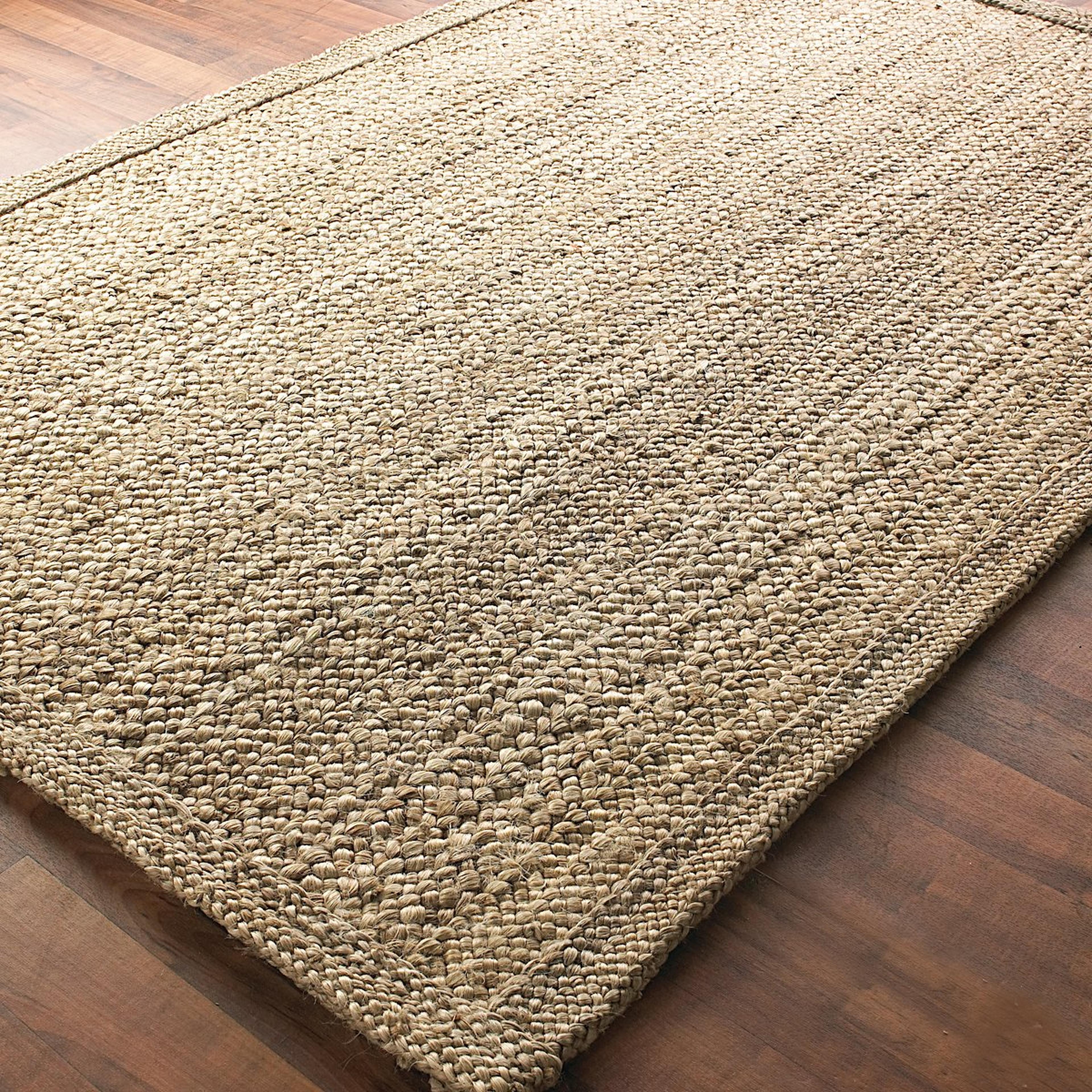 A Chunky Boucle Braided Jute Rug with undefined color