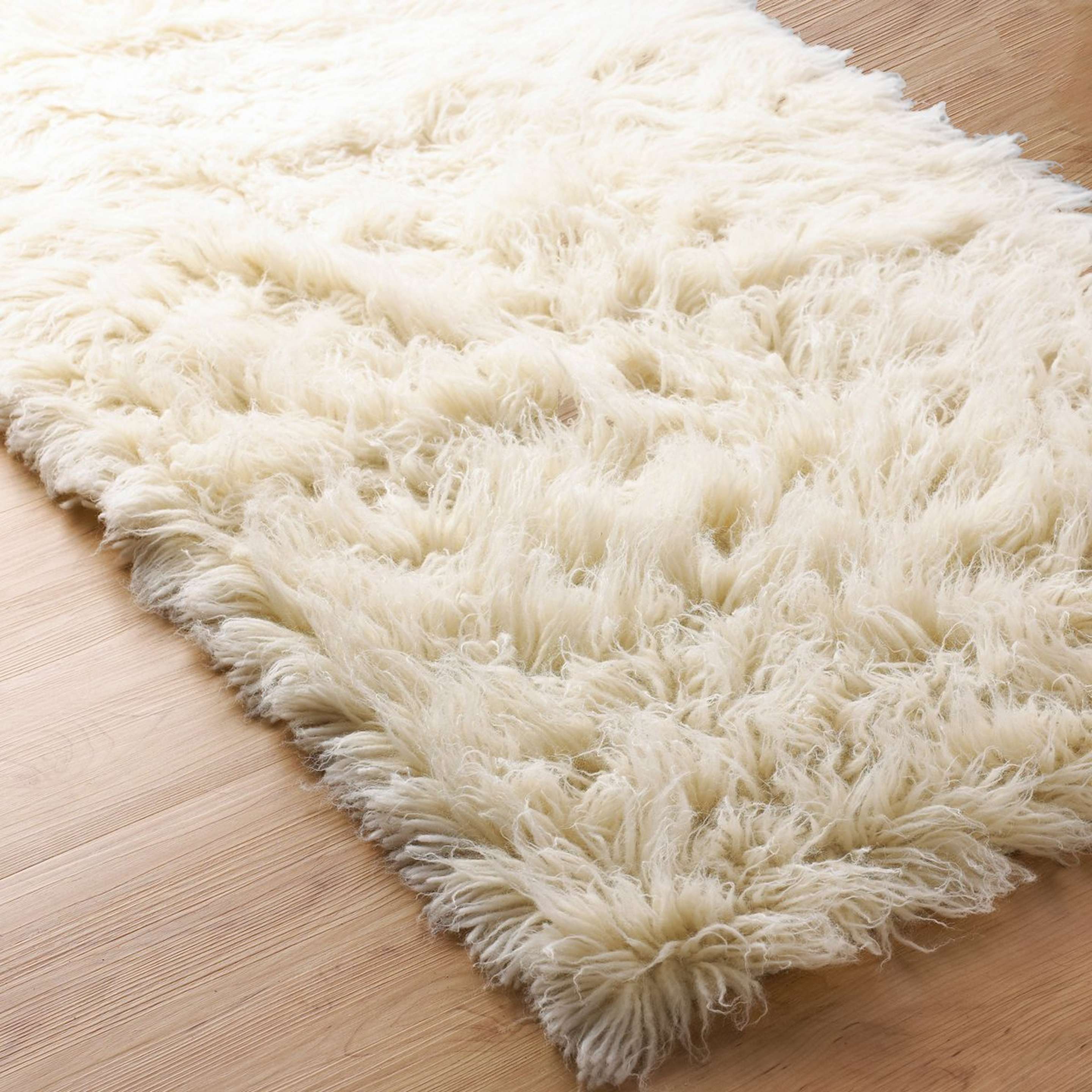 A Superior Flokati Wool Rug with Cream color