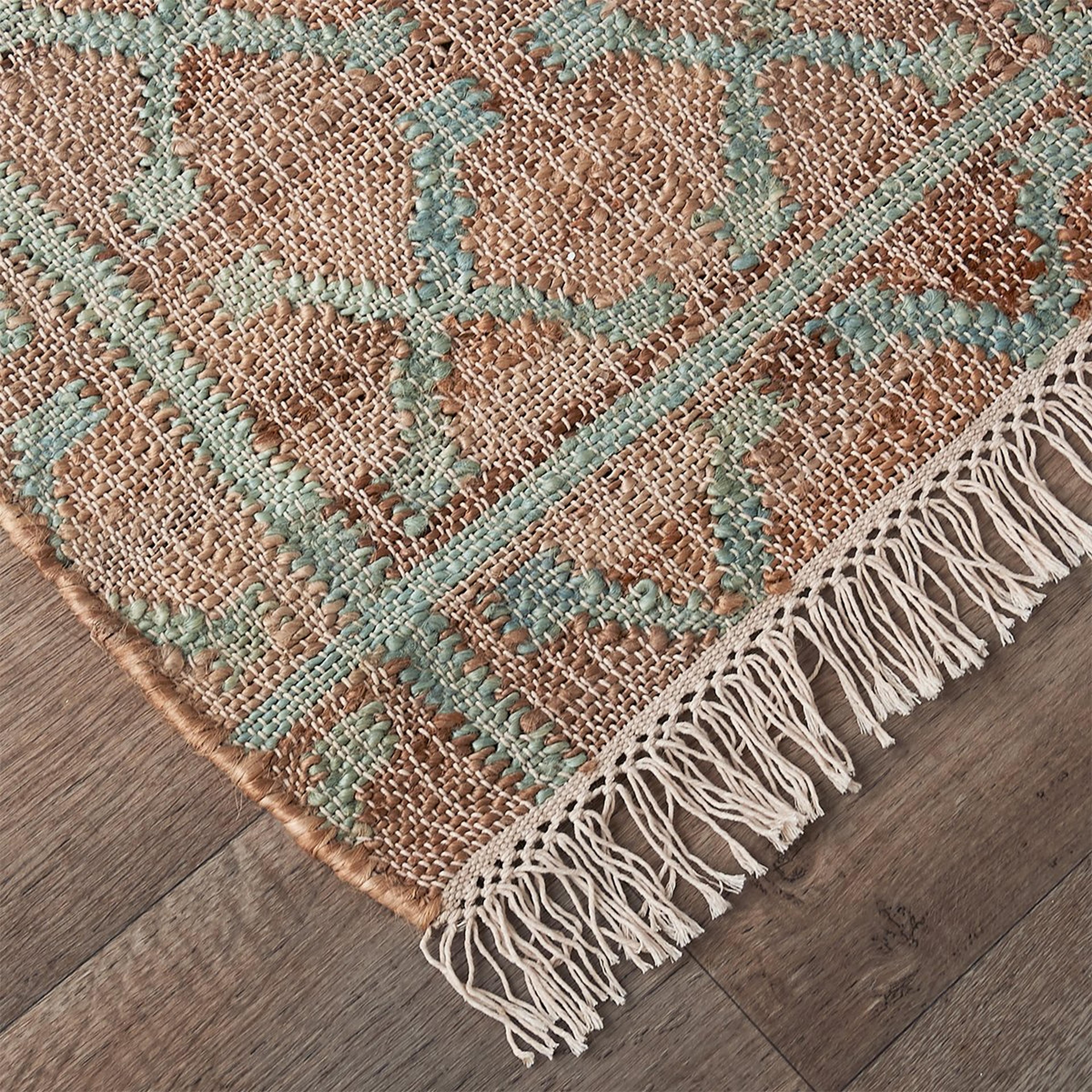 A Ozette Handwoven Rug with Dusty Sage / Tan / Cream color