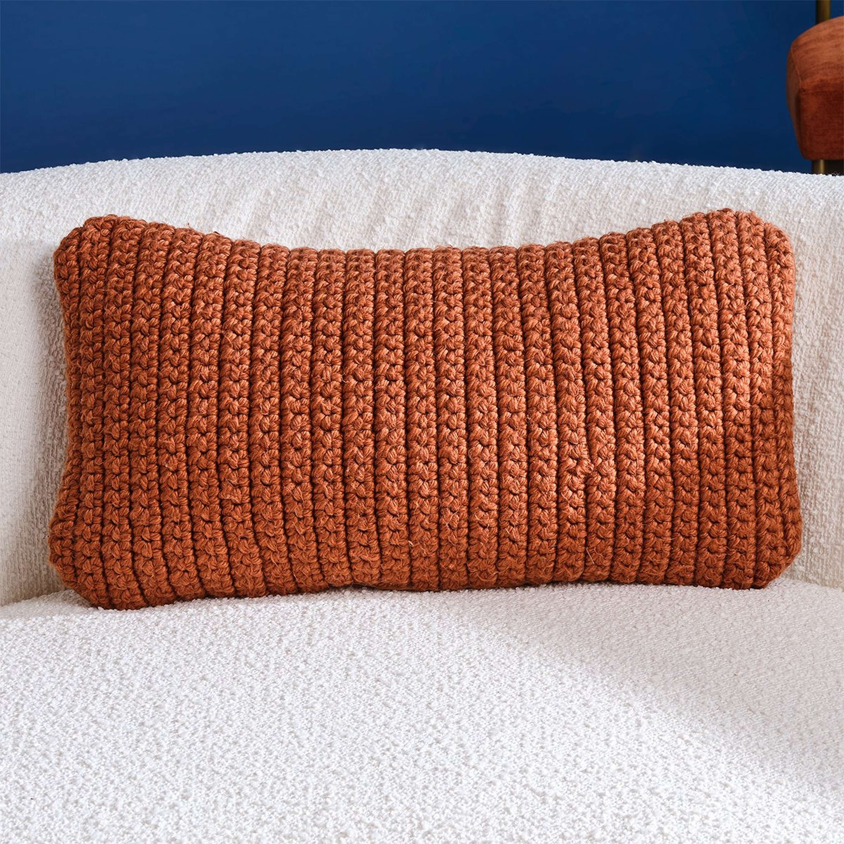 A Hilo Outdoor Lumbar Pillow with Terracotta color