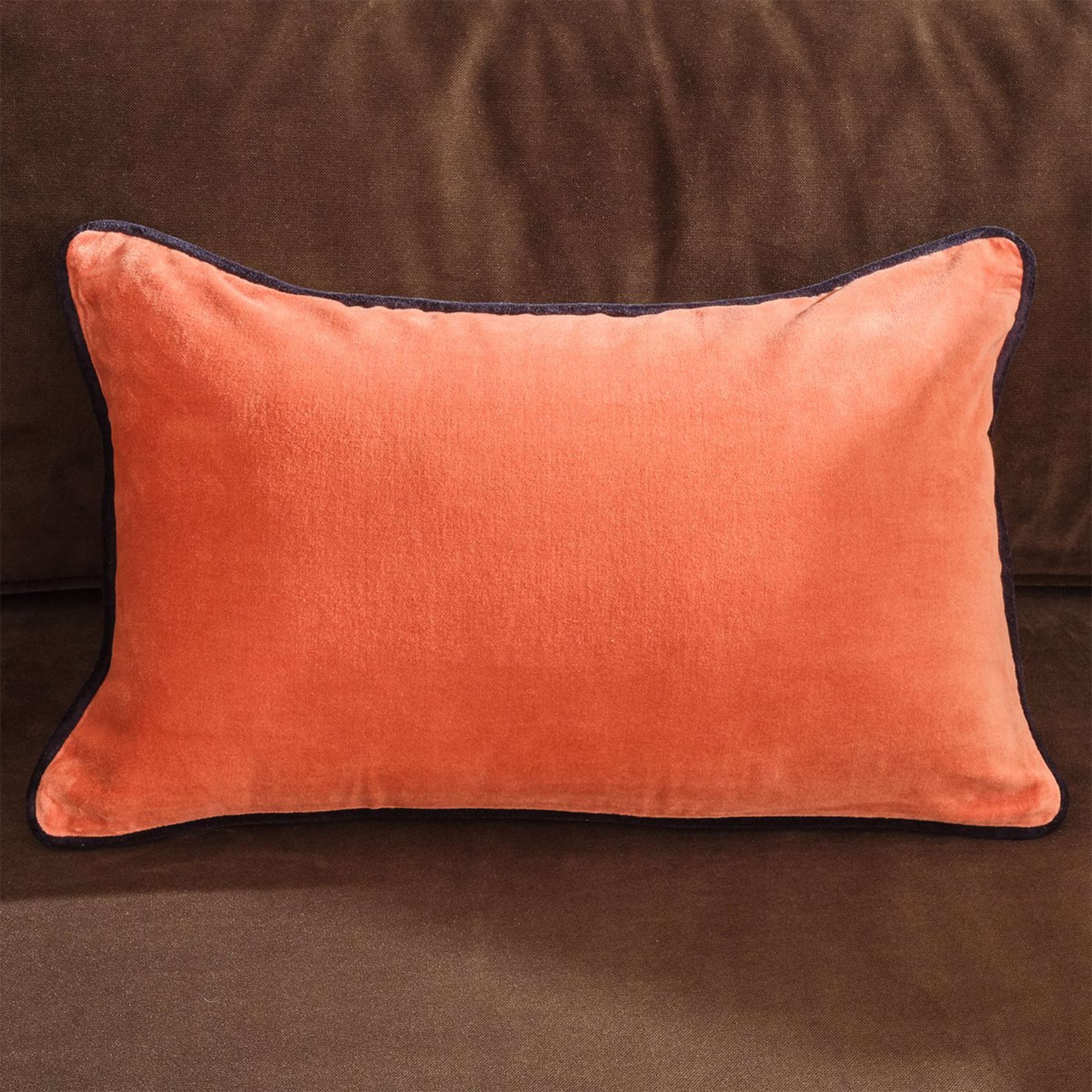 A Velutto Pillow with Peach / Black color