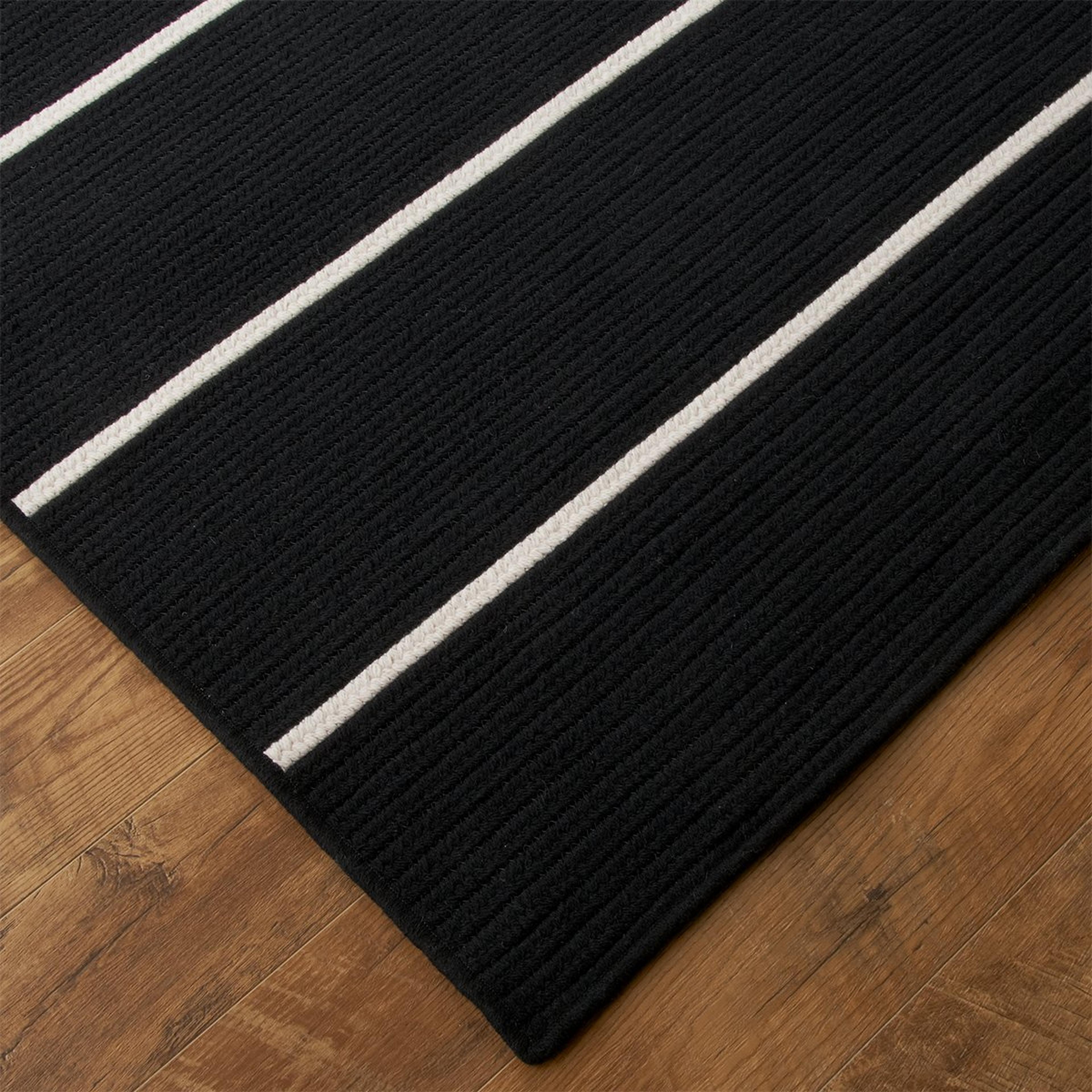 A Shiplap Stripe Braided Rug with undefined color