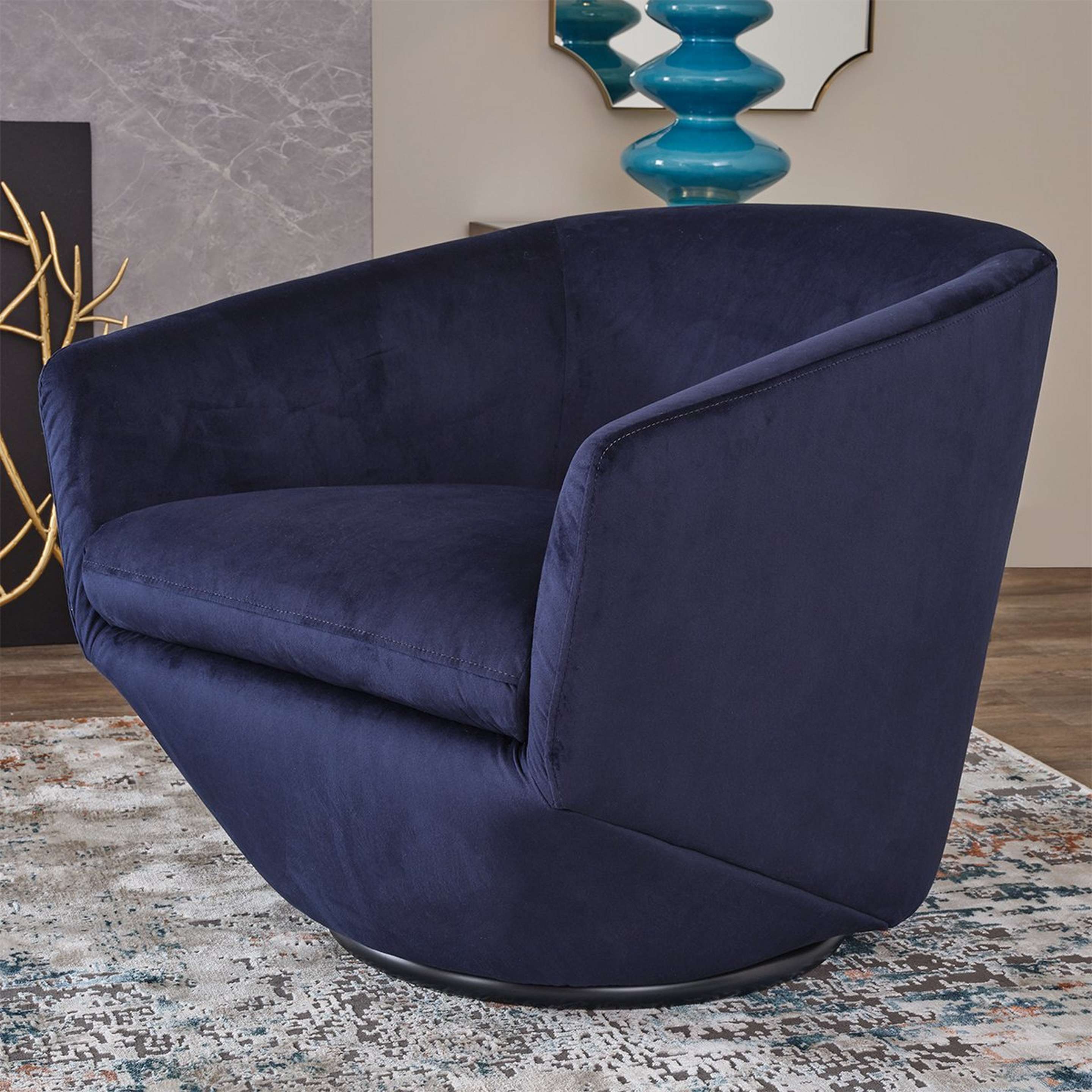 A Veneto Swivel Chair with Blue Velvet Upholstery color