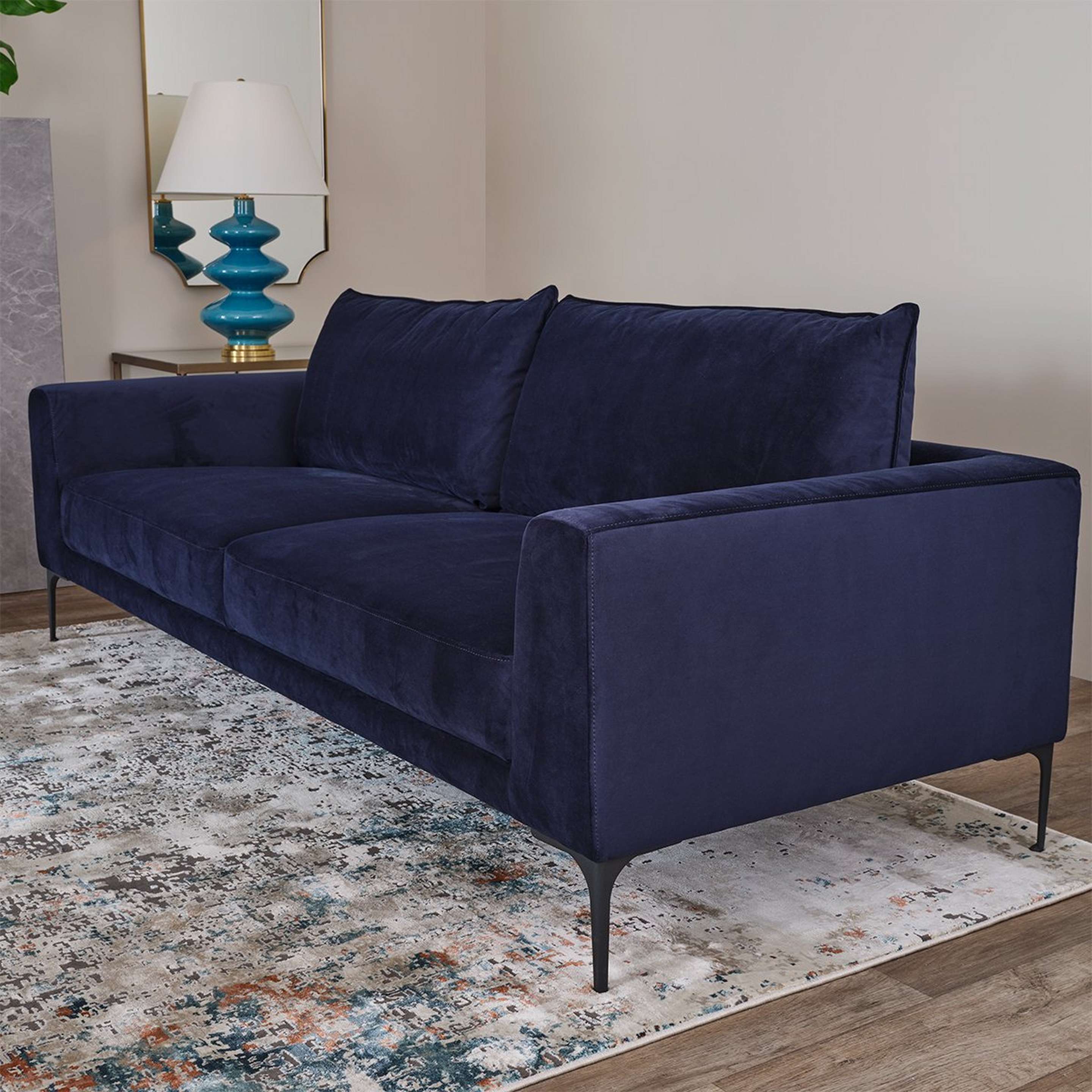 A Demeter Sofa with Blue Velvet Upholstery / Black color