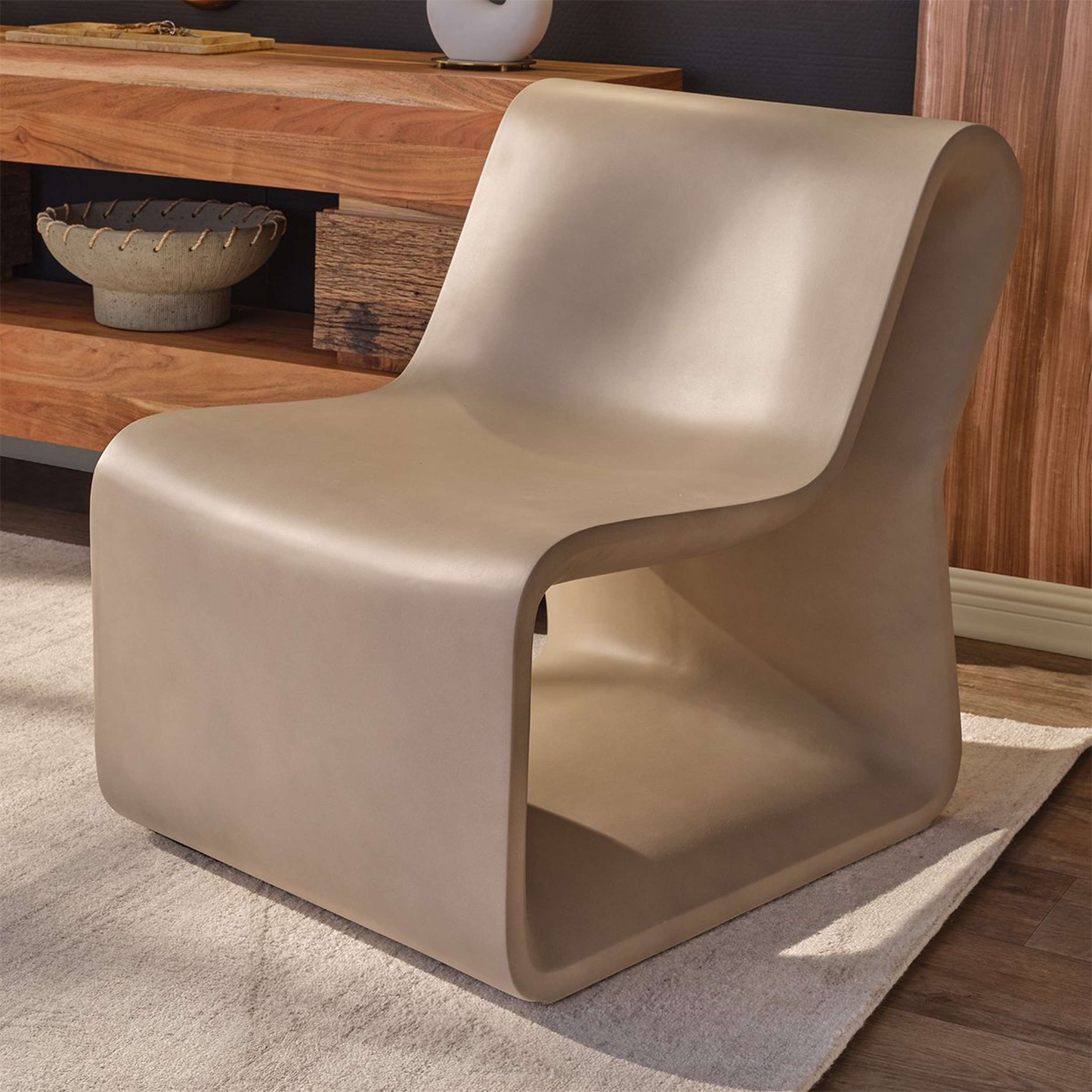 A Scylla Outdoor Chair with Concrete color