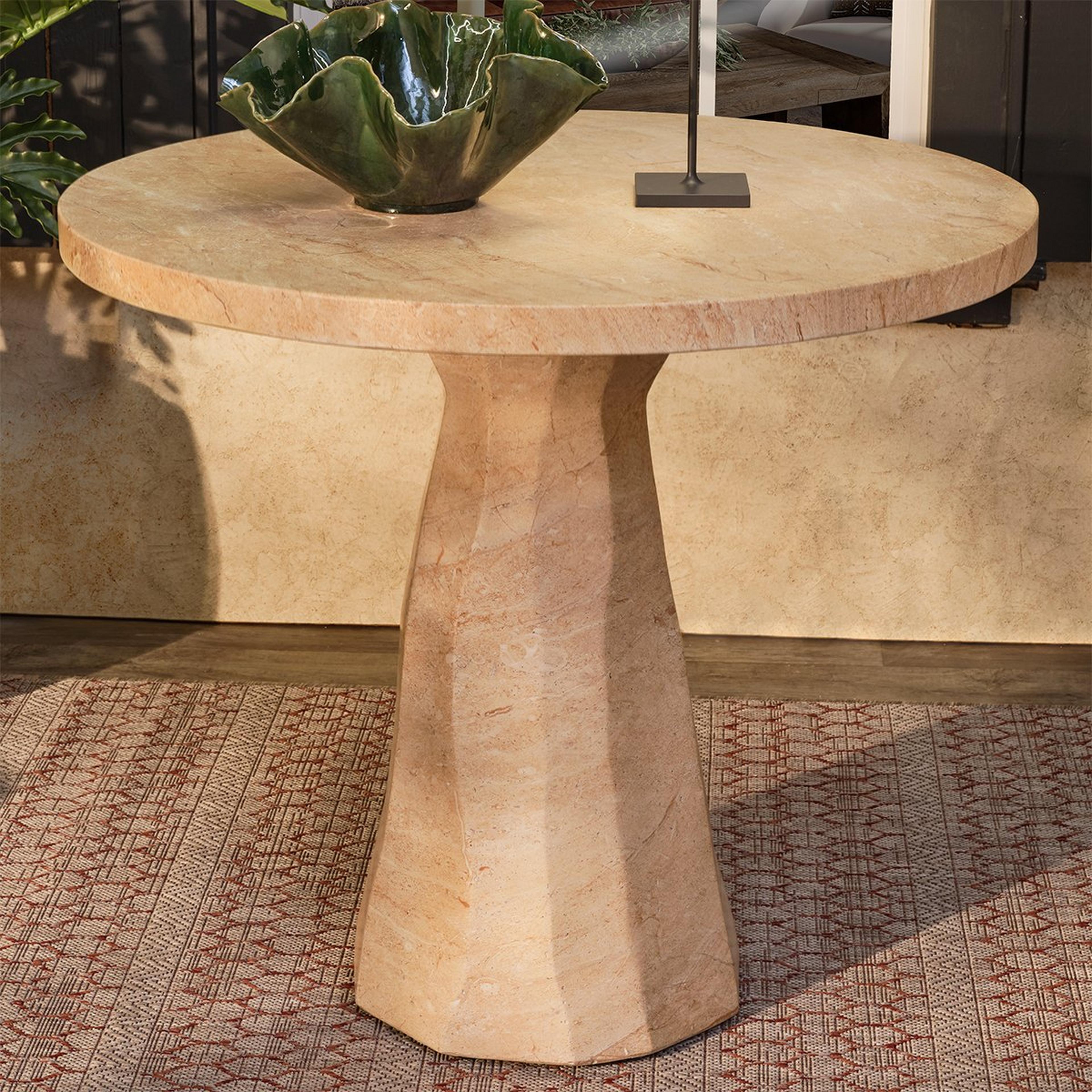 A Mandy Faux Travertine Outdoor Bistro Table with Beige Travertine color
