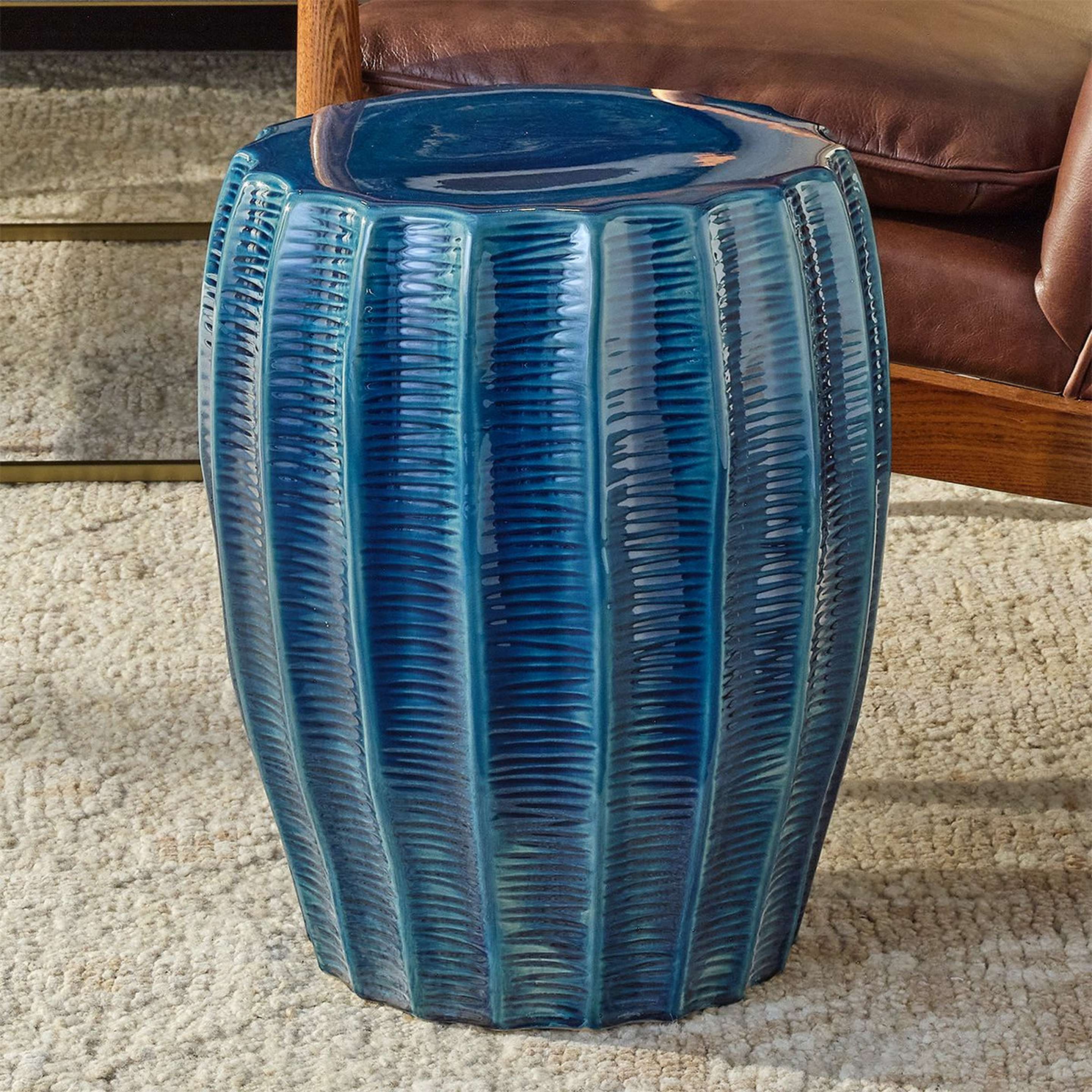 A Hopper Accent Stool with Blue Ceramic Glaze color