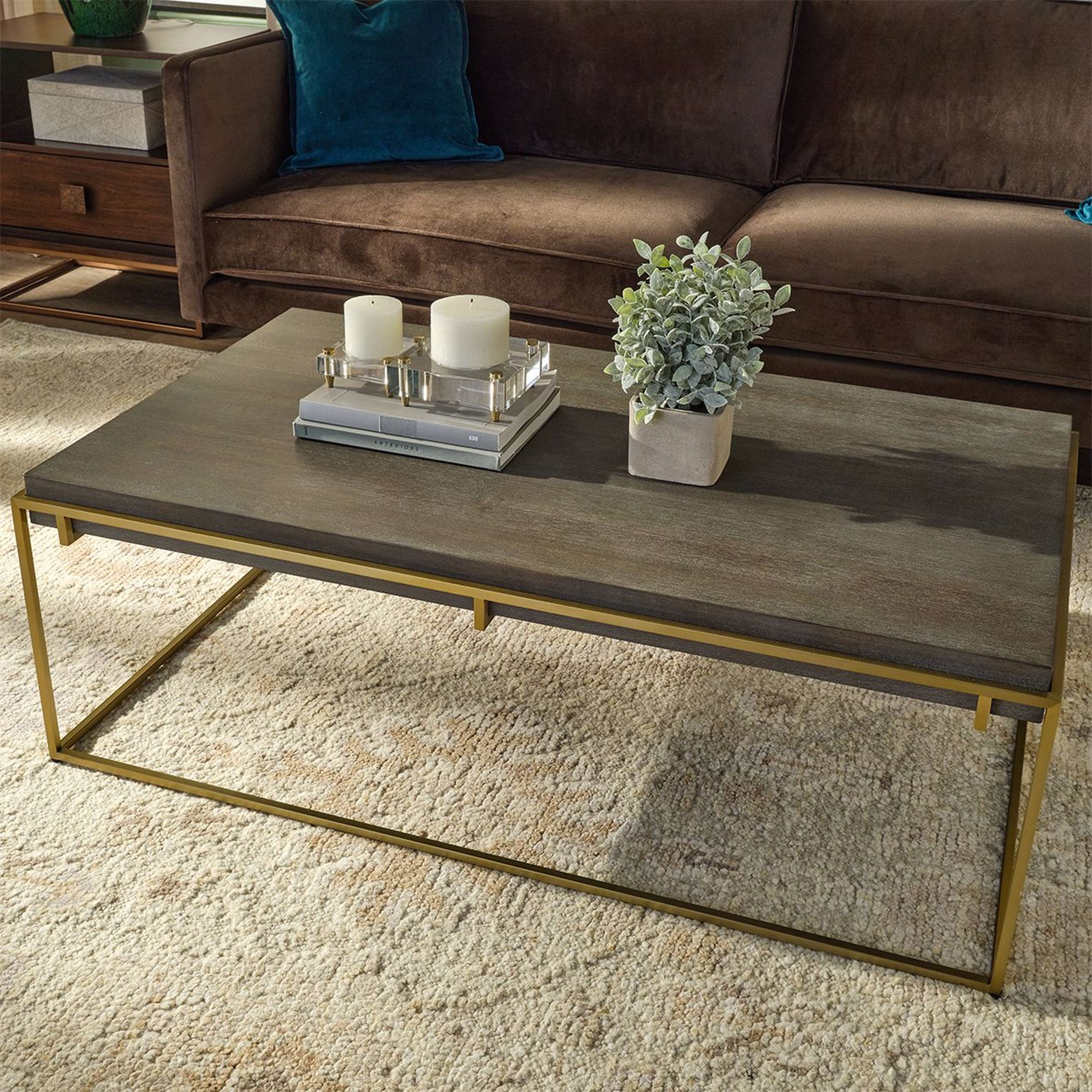 A Perivalli Coffee Table with Gray Washed Wood / Gold color