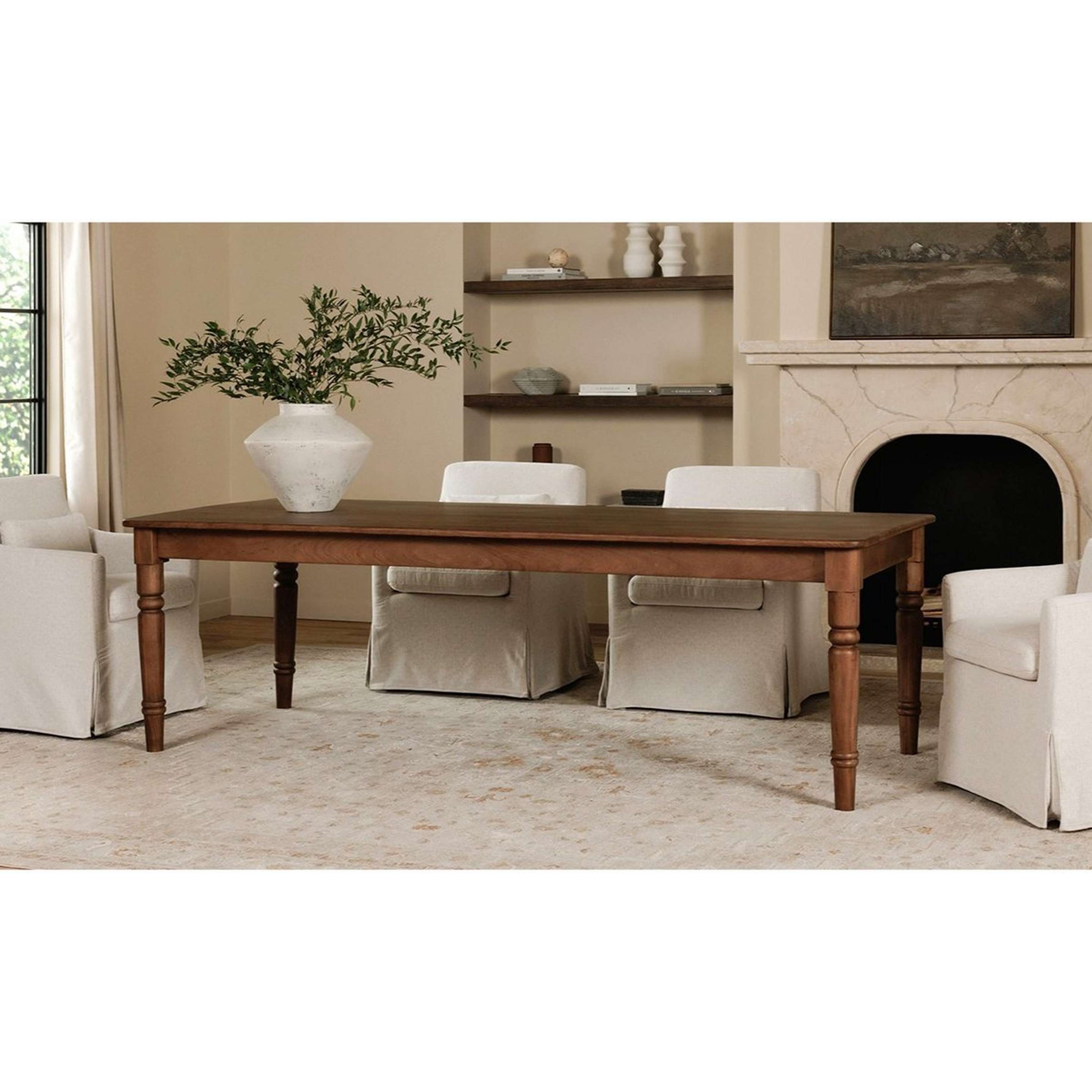 A Hilliard Dining Table with Dark Wood color