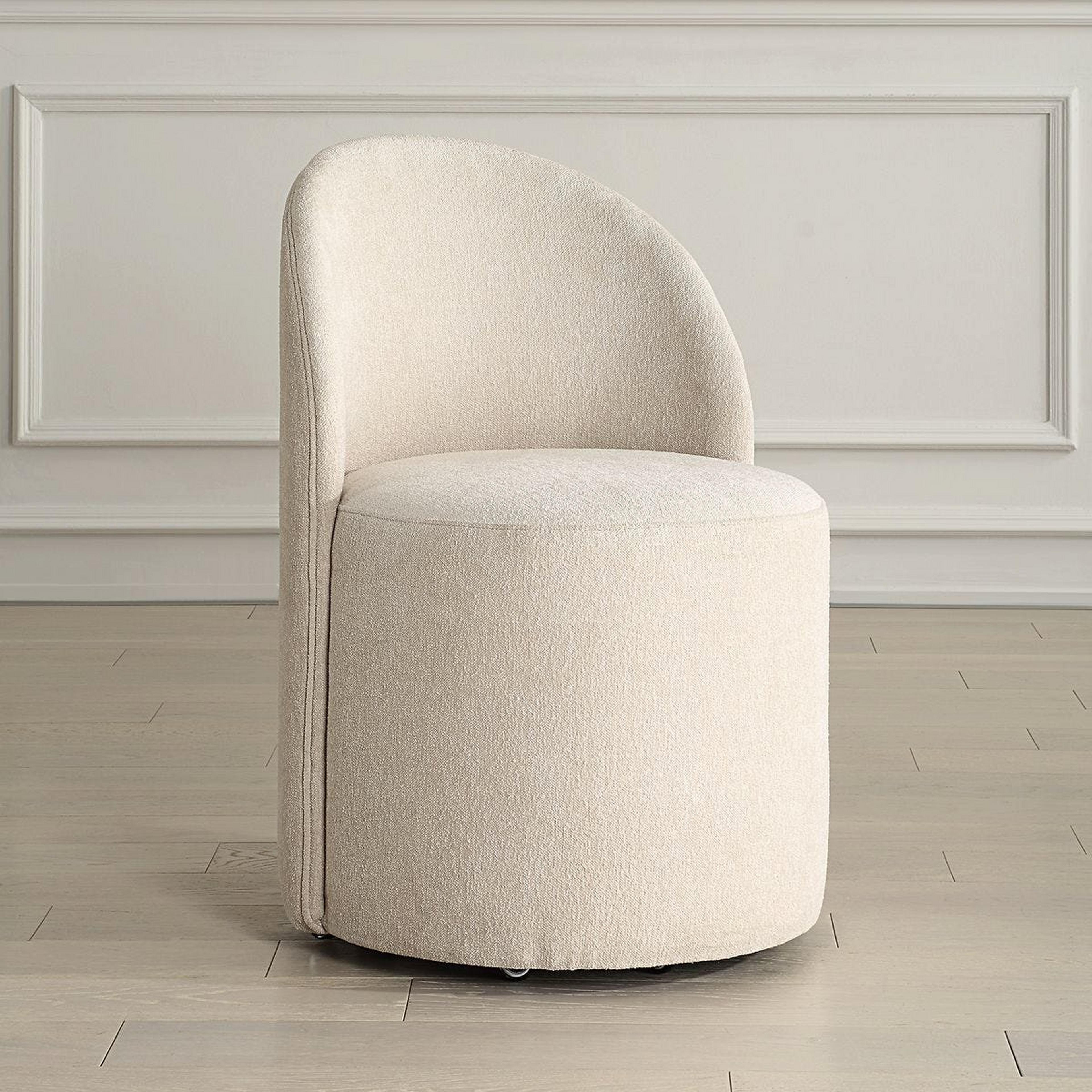 A Enora Rolling Dining Chair with Sand Beige color