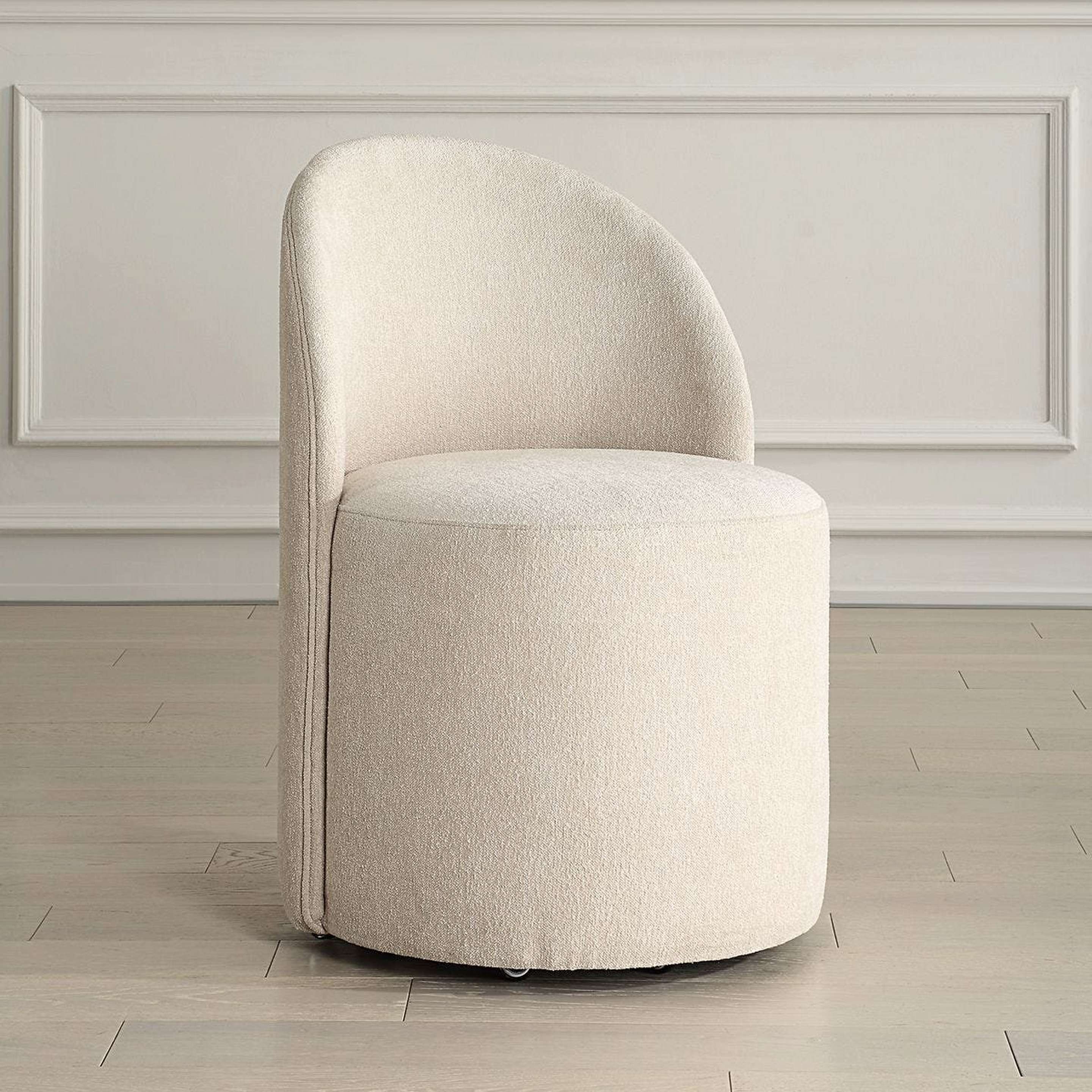 A Enora Rolling Dining Chair with Sand Beige color