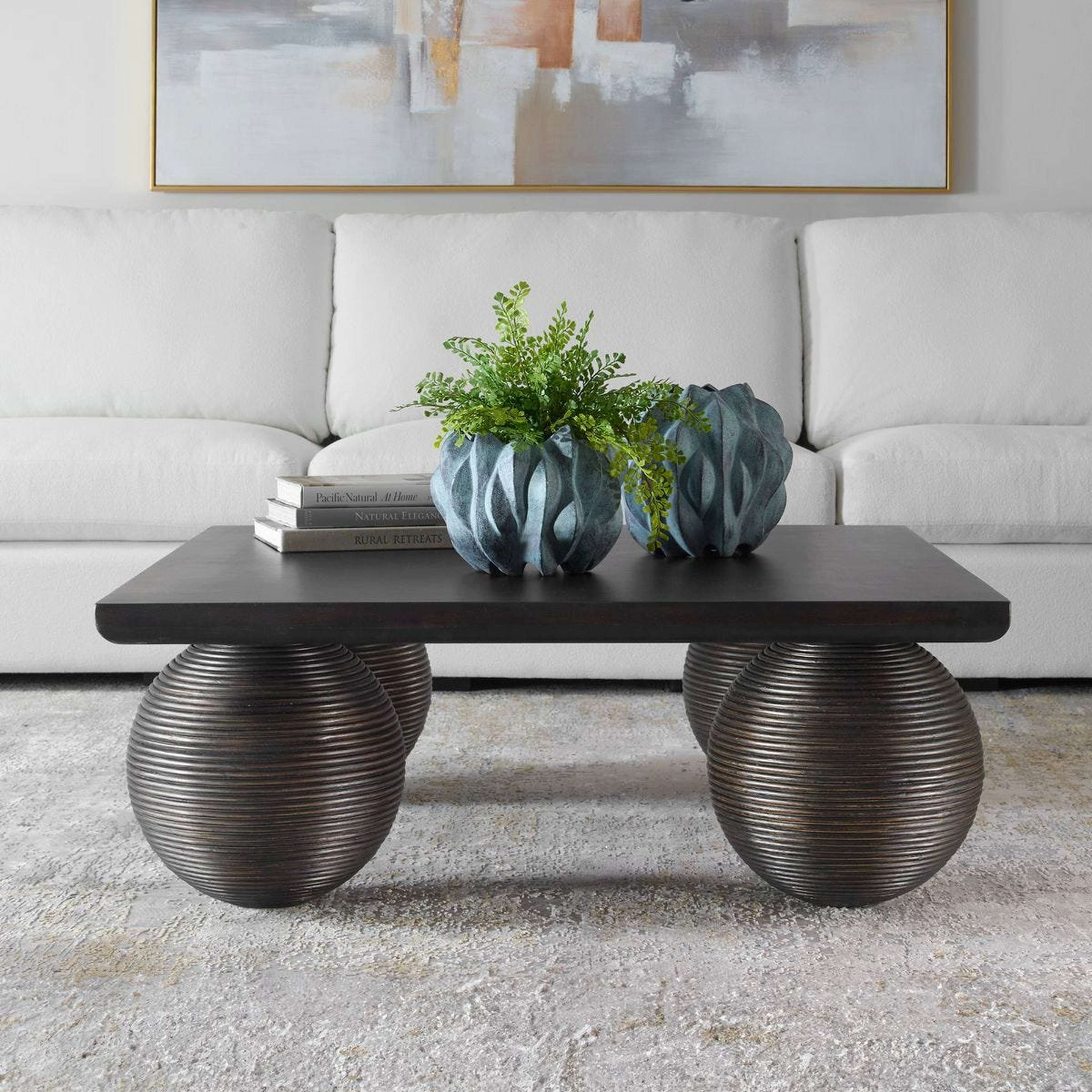 A Cvetka Coffee Table with Weathered Black color