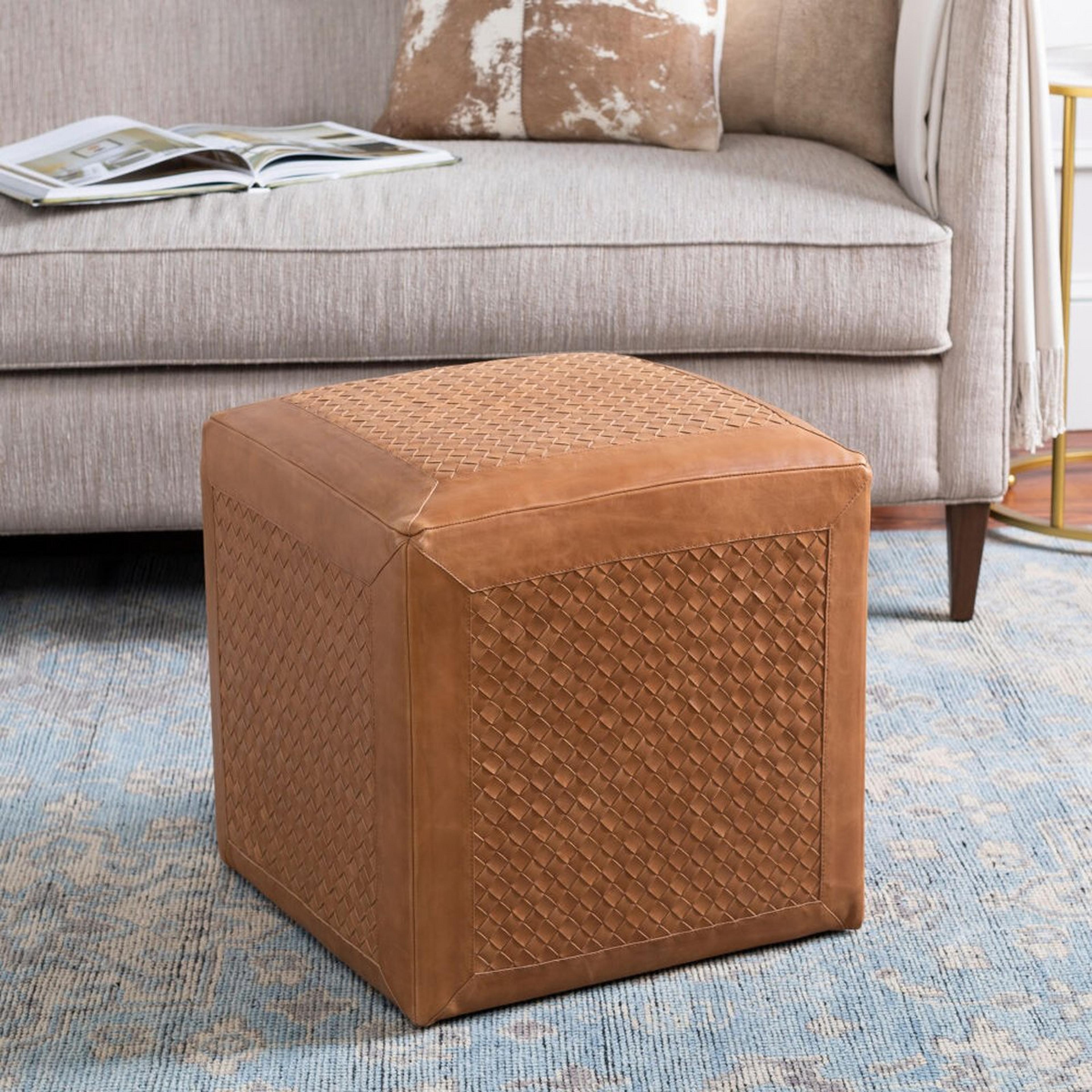 A Jazlyn Ottoman with Brown Leather color