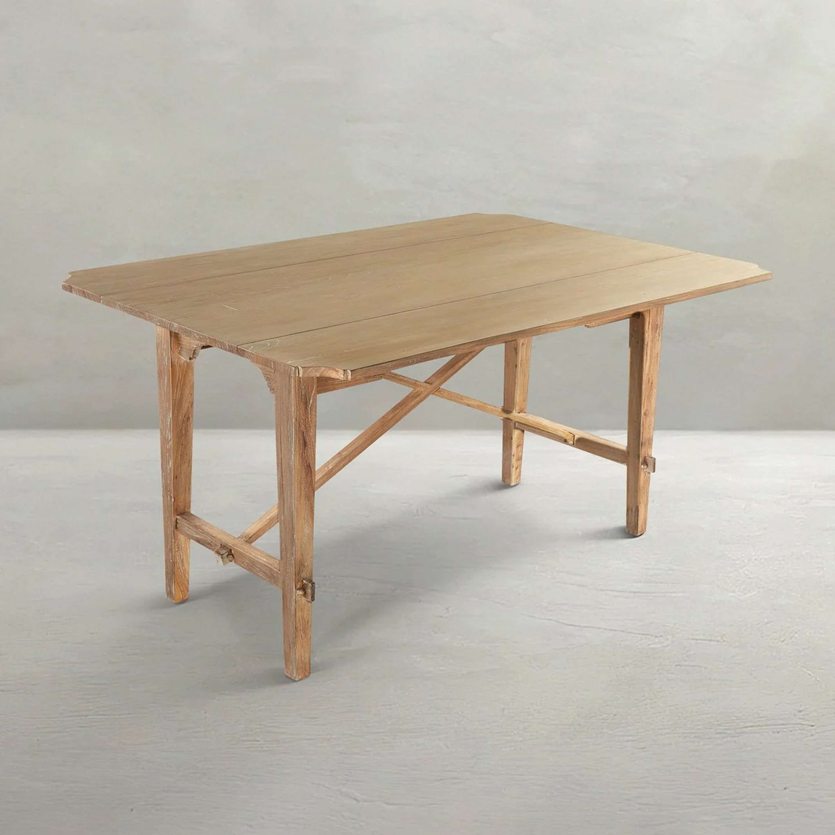A Haru Drop-Leaf Table with Natural Elm Wood color