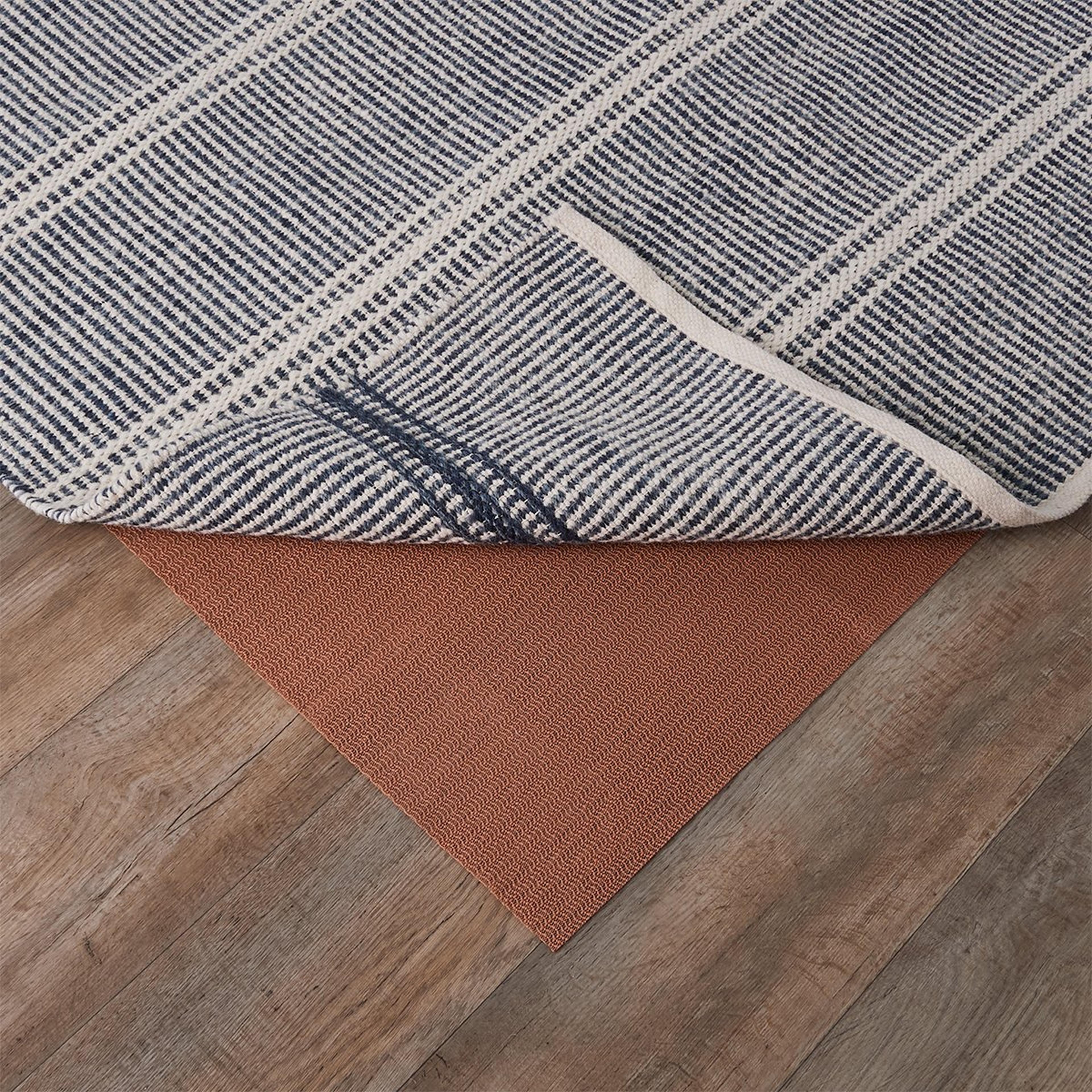 A Rug Stop Rug Pad with Beige color