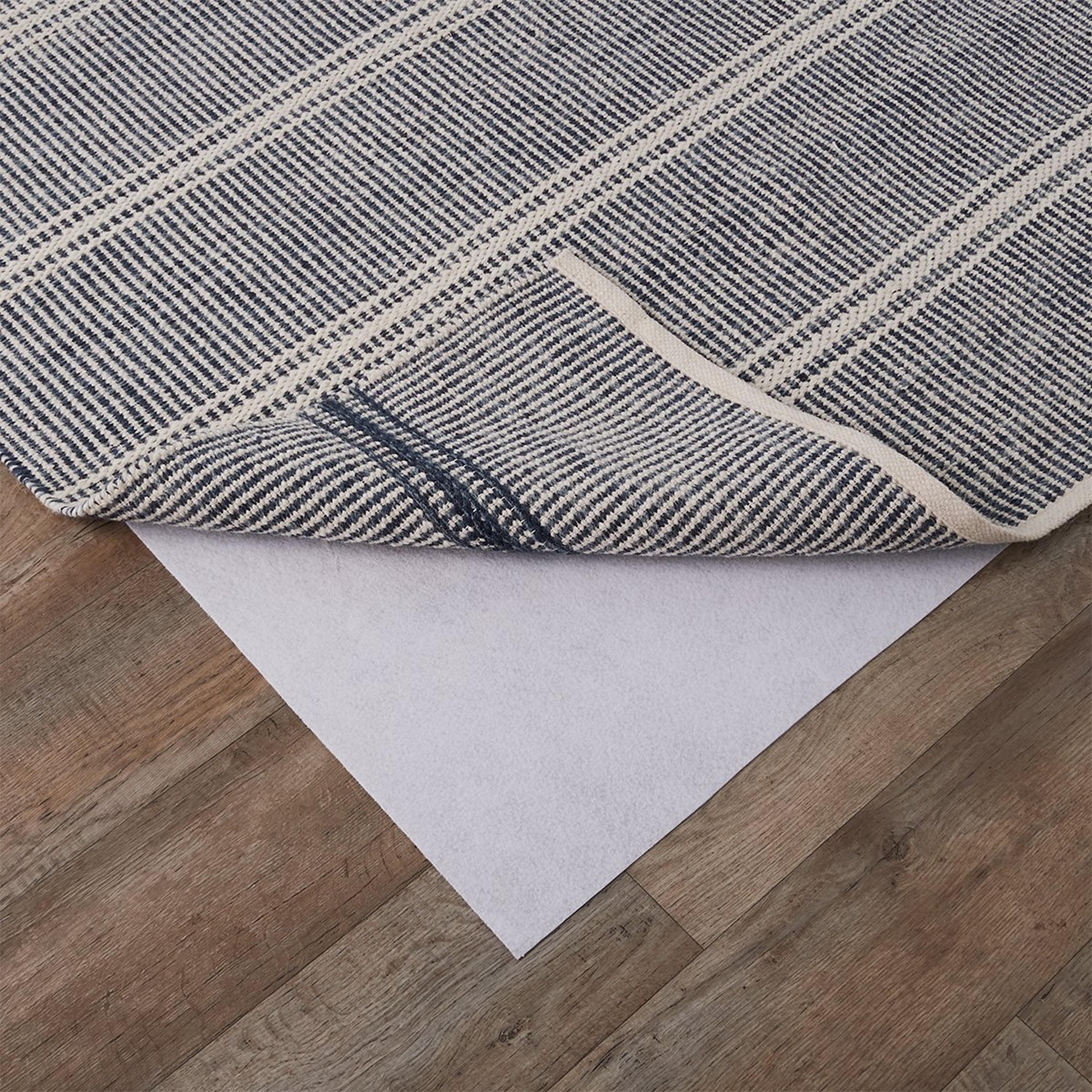 A Magic Stop Rug Pad with White color