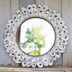 Round beach themed mirror in oyster shell
