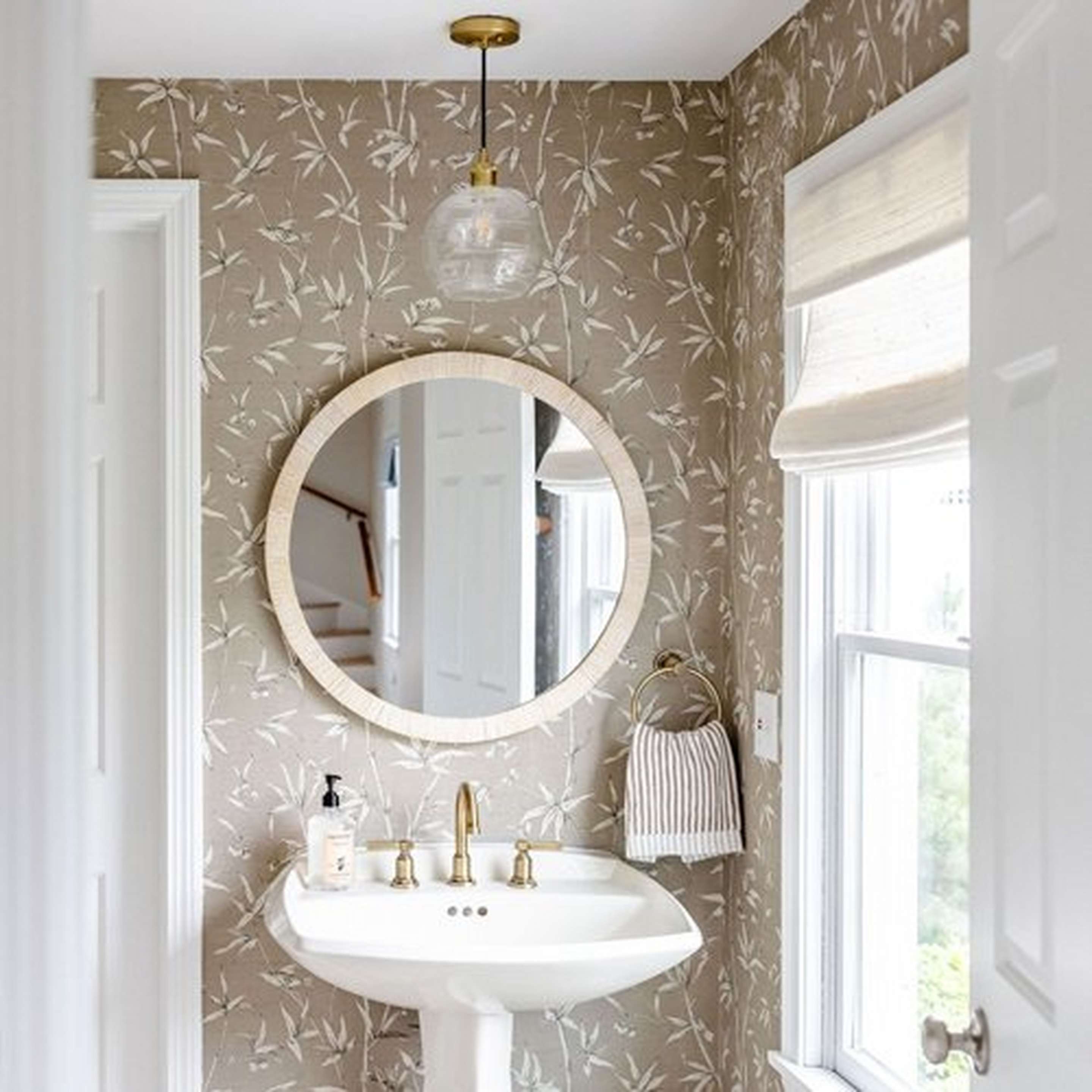 Mixed Metal Sea Swell Pendant over bathroom sink