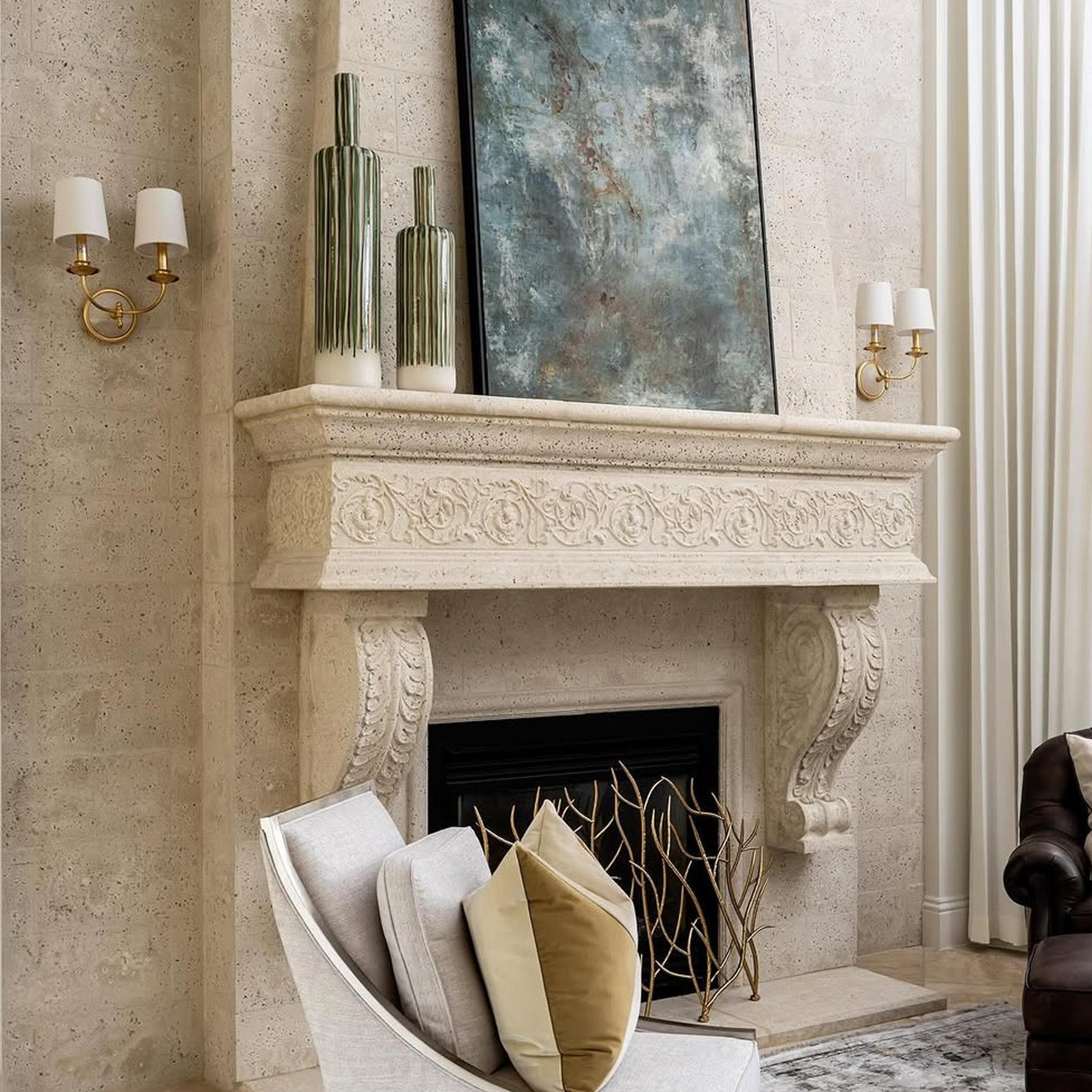 2-light sconces framing an ornate mantle