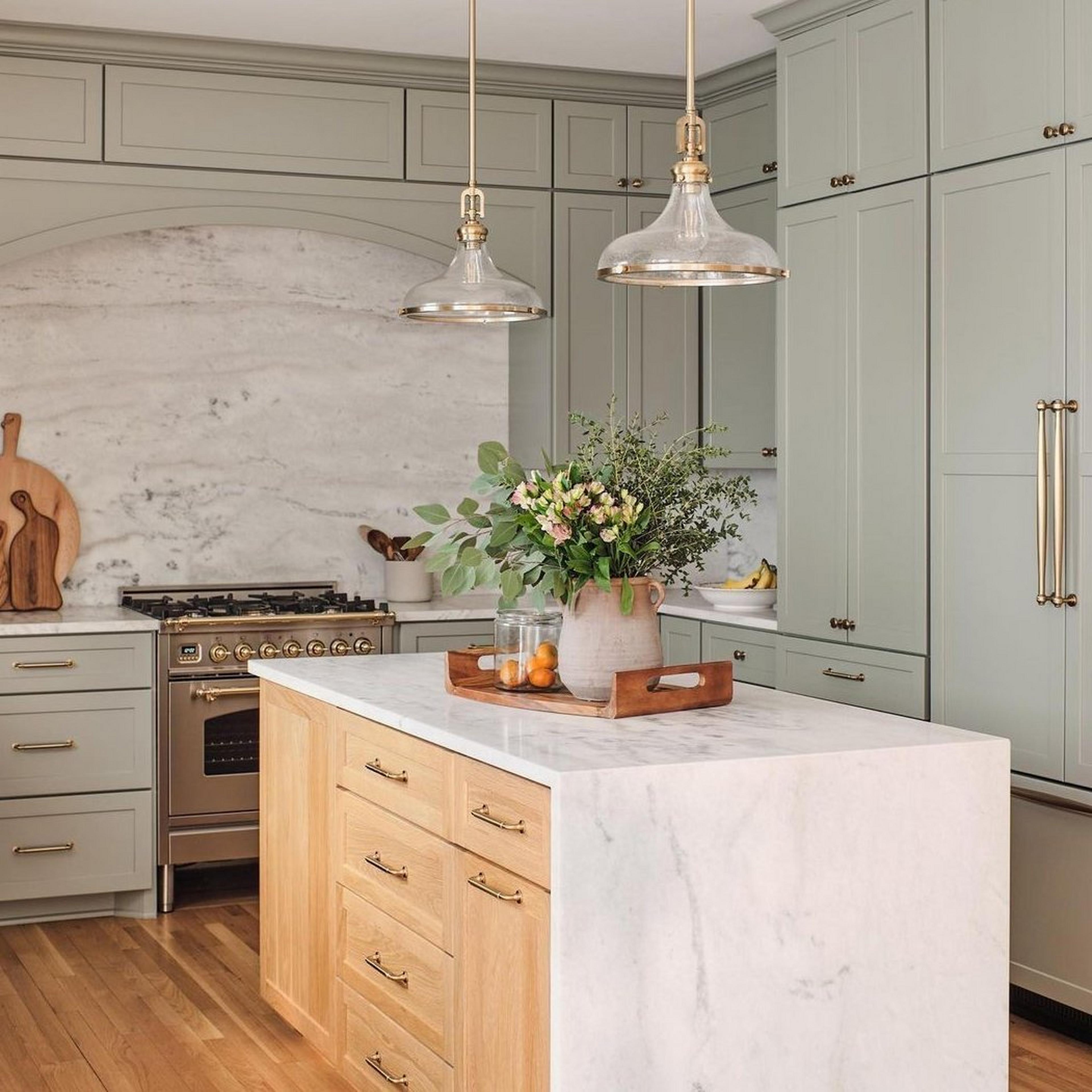 Satin Brass Perry Pendants in a green kitchen