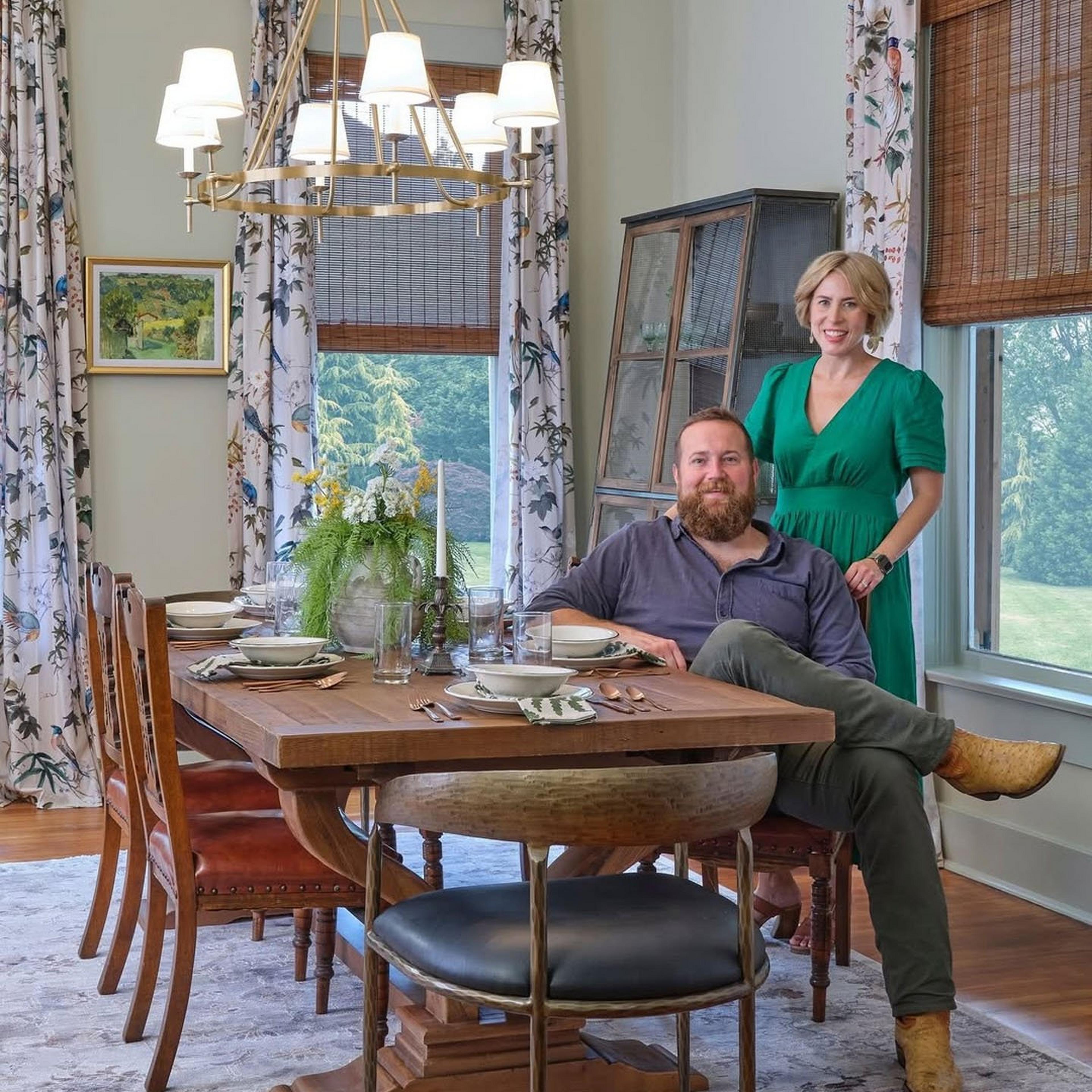 Erin and Ben Napier in a dining room with the Watkins chandelier