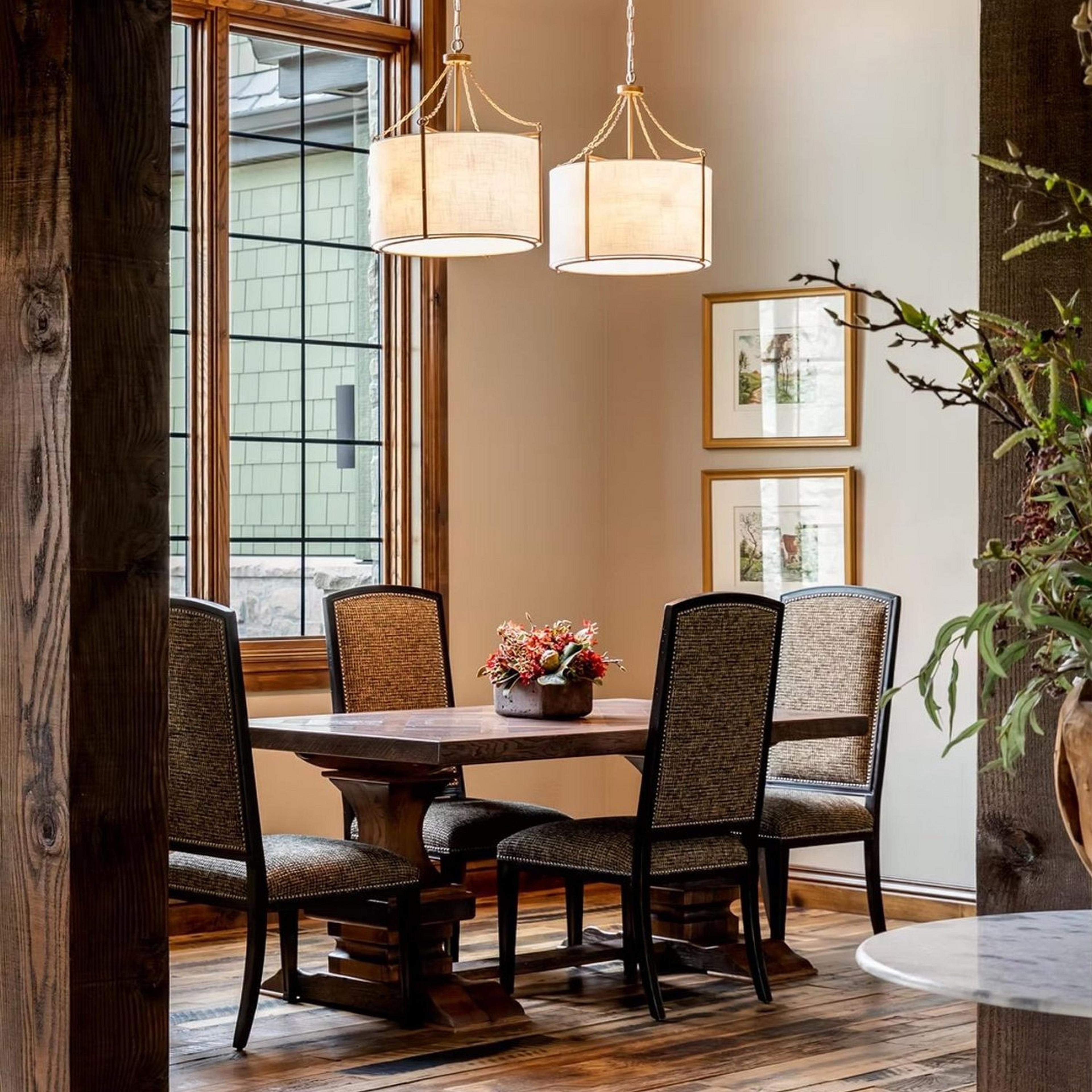 Two Classic Carousel Chandeliers in a rustic dining room