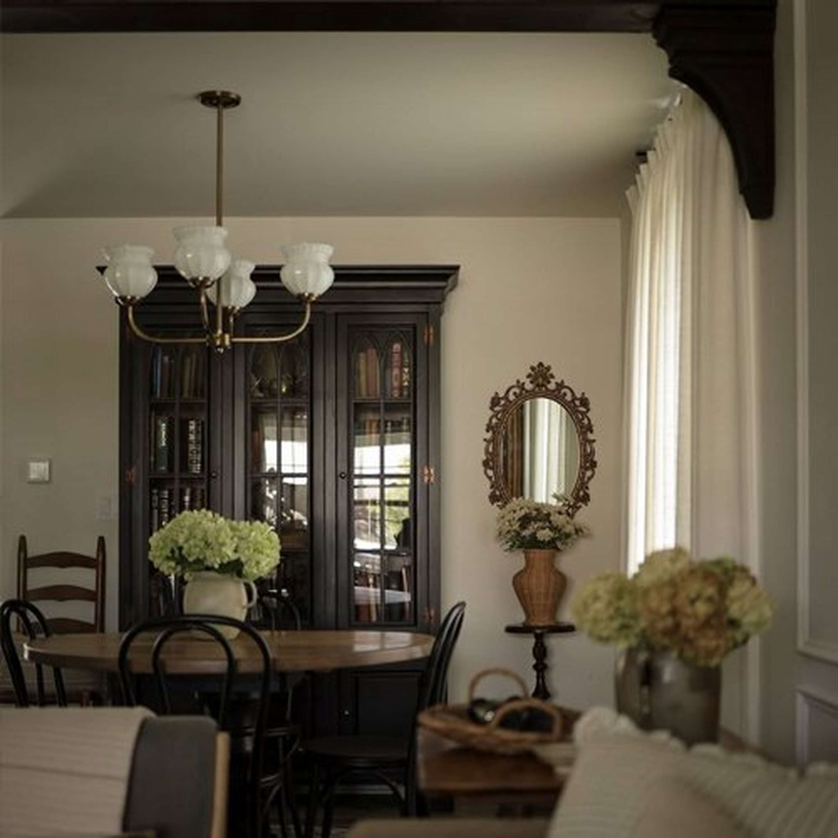 Chris Loves Julia Marlo Chandelier in a dining nook