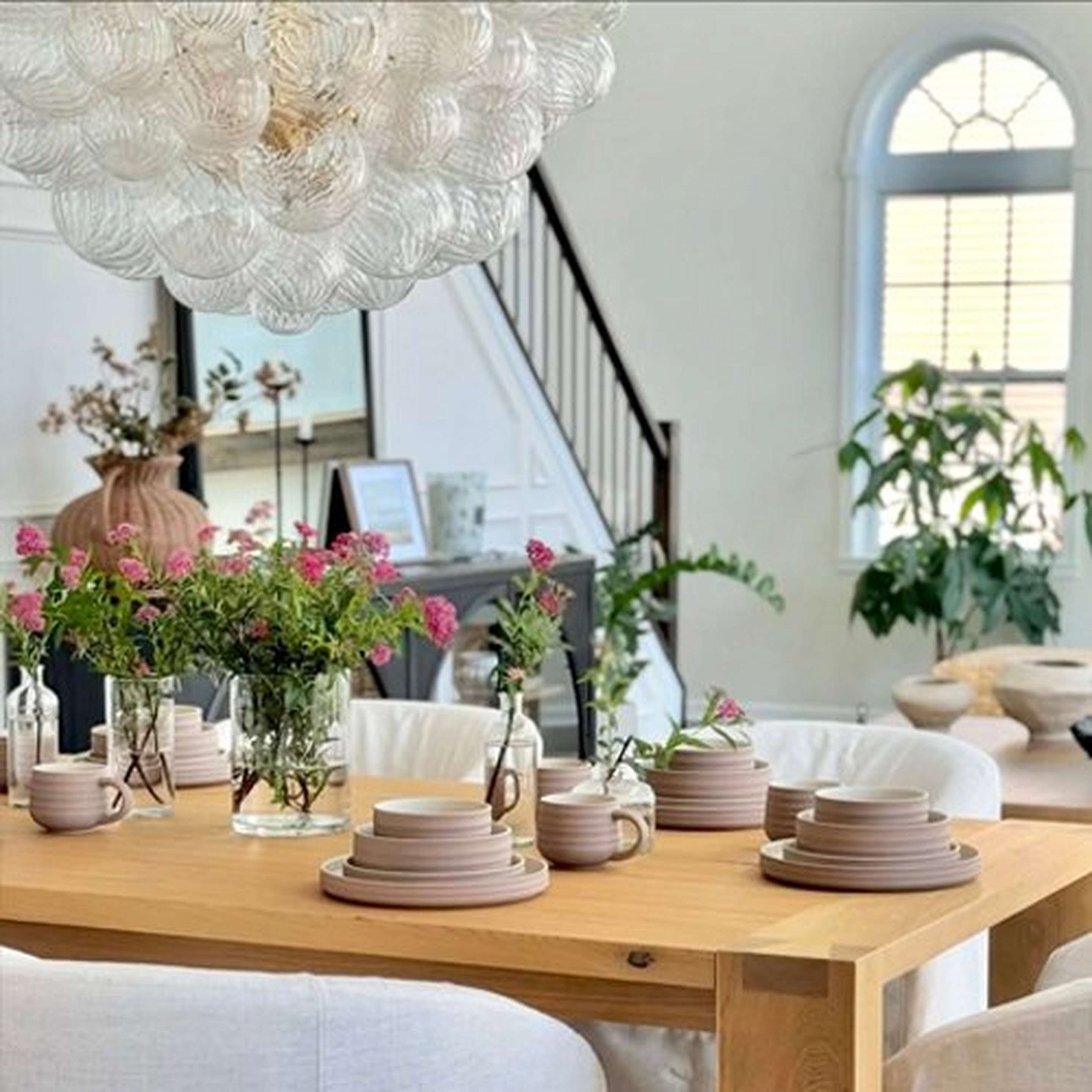 Amalia Chandelier above a dining table with place settings