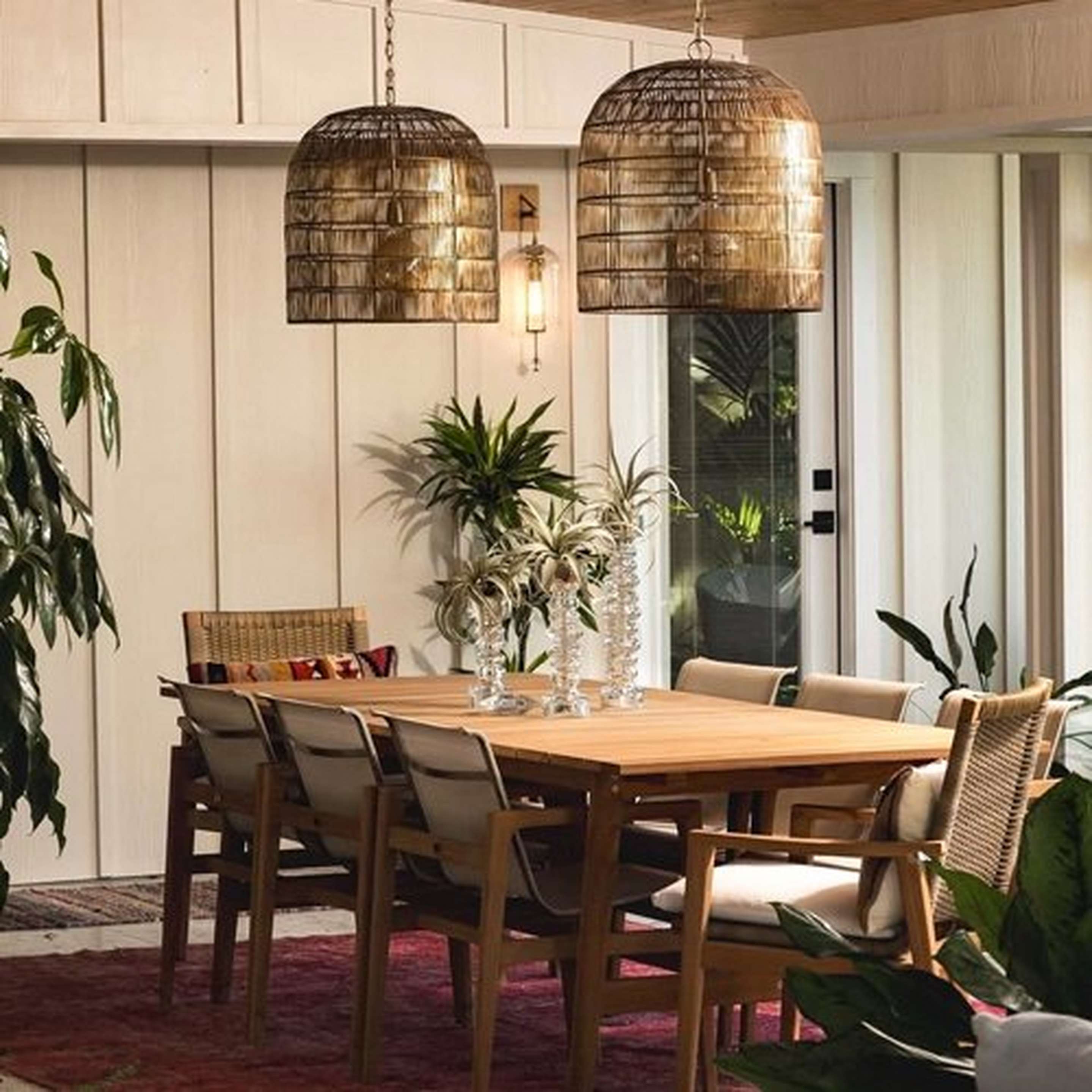 Two Sculpted Cage Pendants on an outdoor patio 