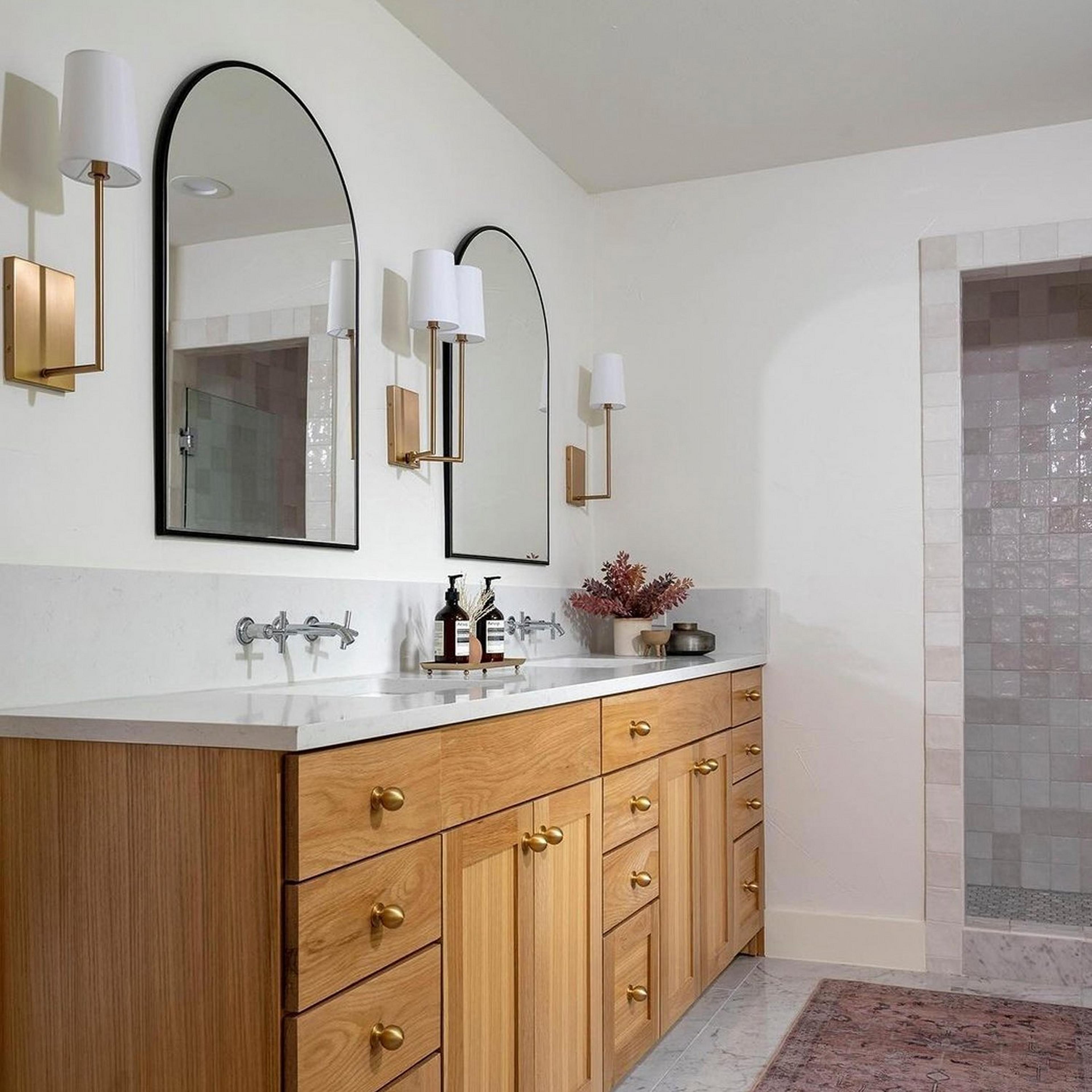 Aged gold Stark Minimalist Sconce in a bathroom