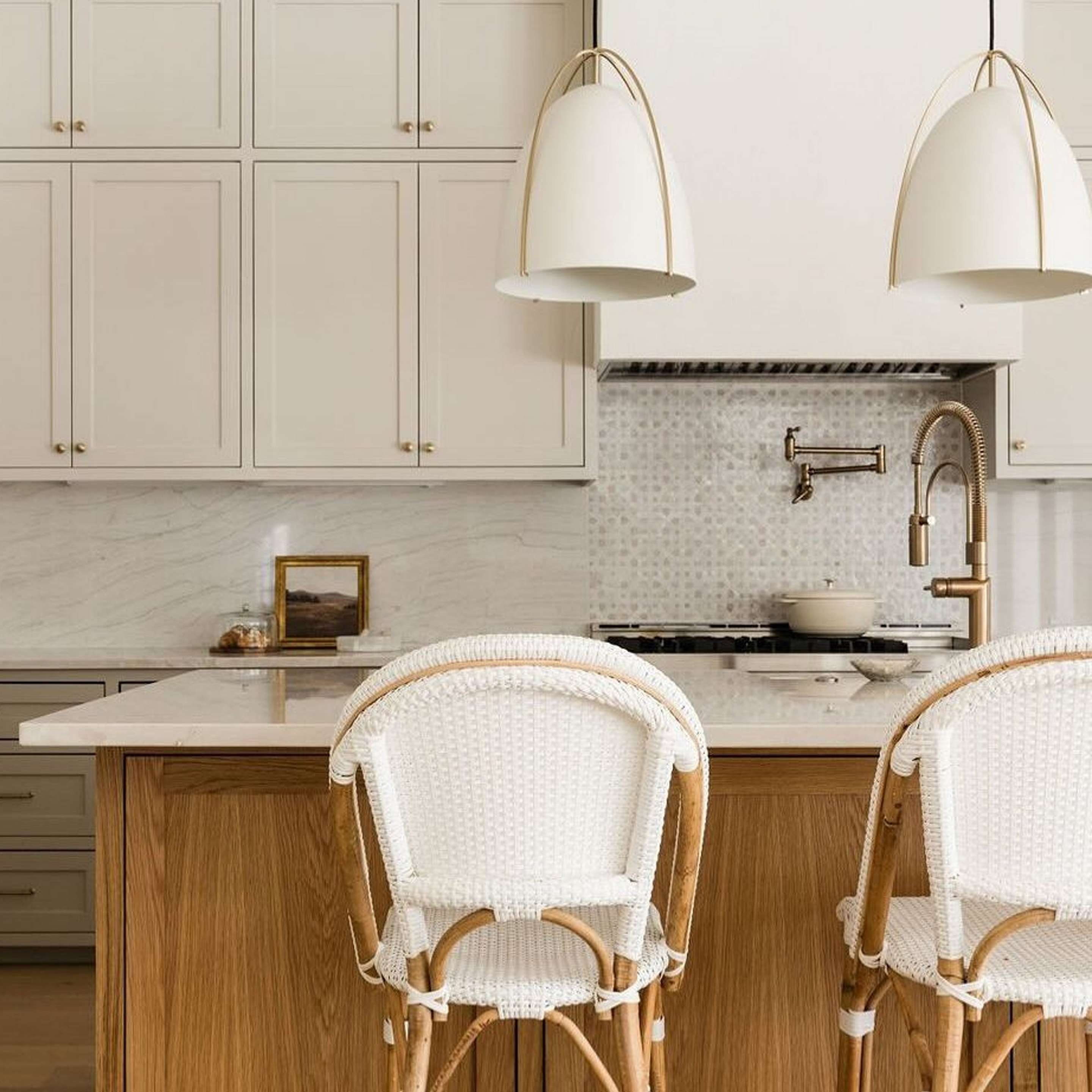 Two Large White Bentlee Pendants in a kitchen