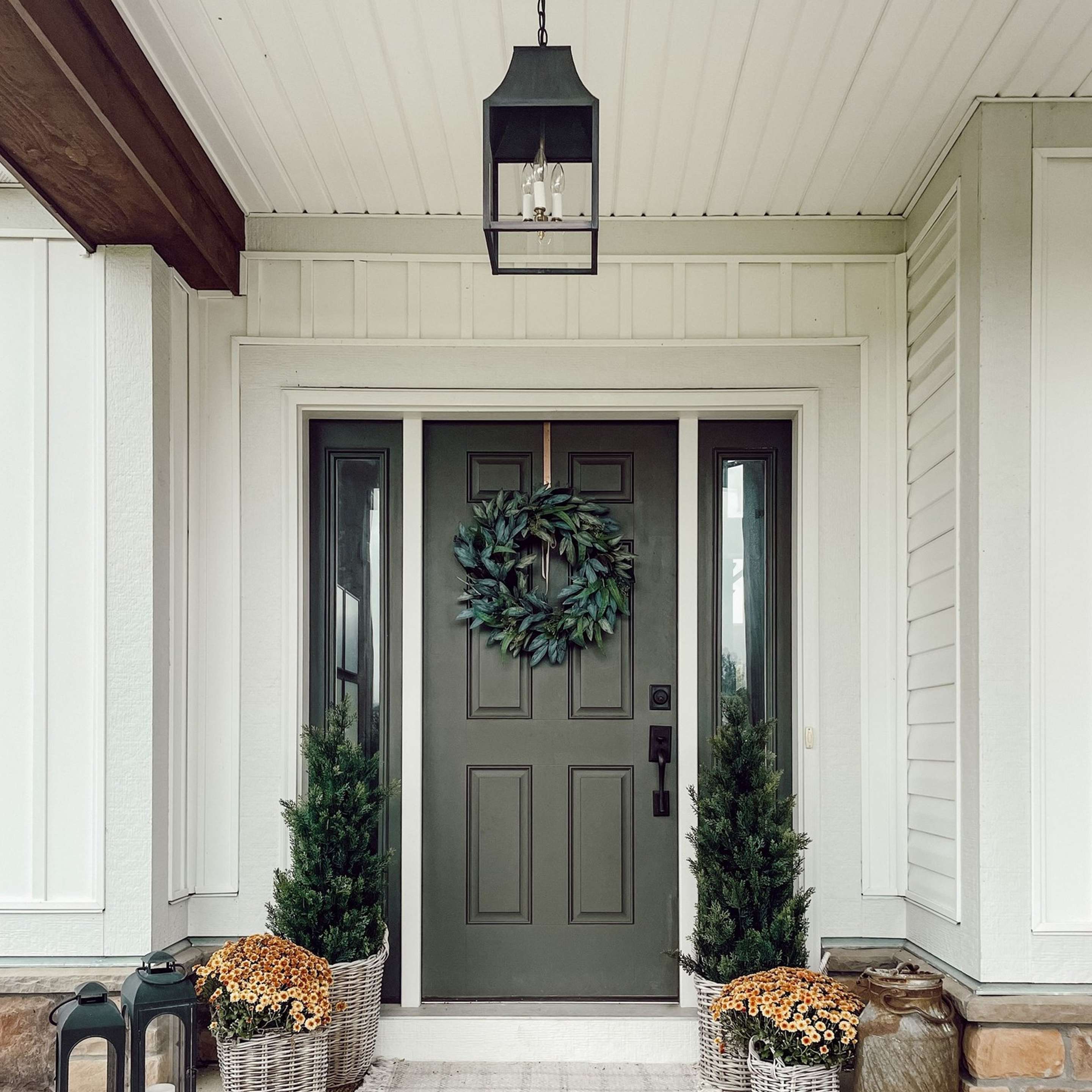 Colonial Metalcrafts Capital Outdoor Lantern on a front porch