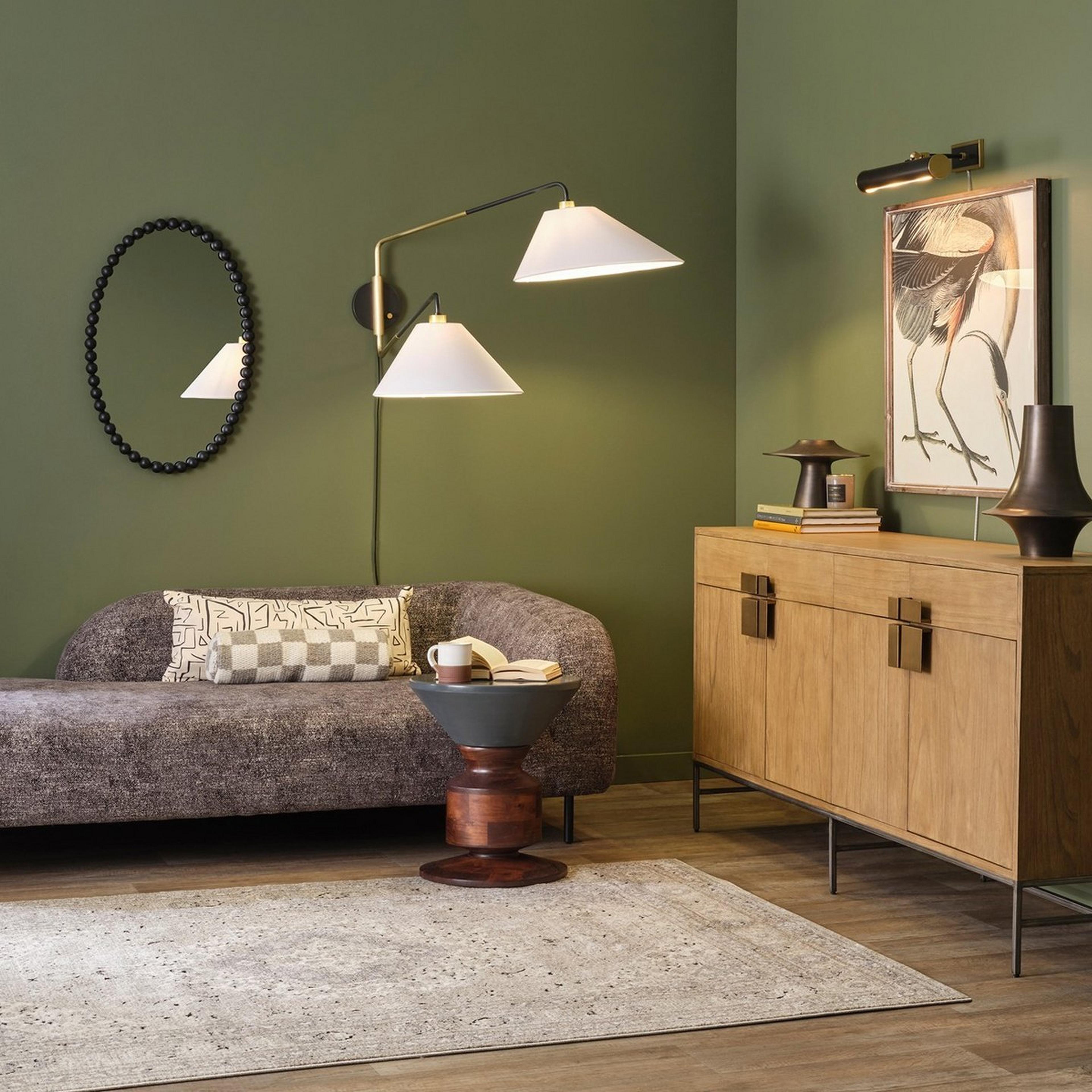Modern Cascadia sitting area with gray chaise lounge and green wall