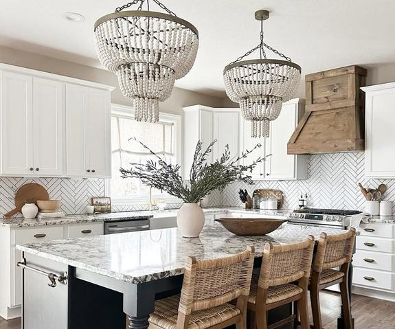 Beaded chandeliers over a kitchen island