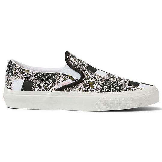 Black floral slip on vans store