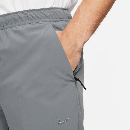 Nike track pants with zipper pockets sale