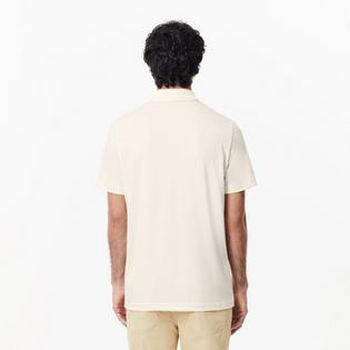 Lacoste Polo de golf Ultra-Dry &agrave; motif miniature pour hommes