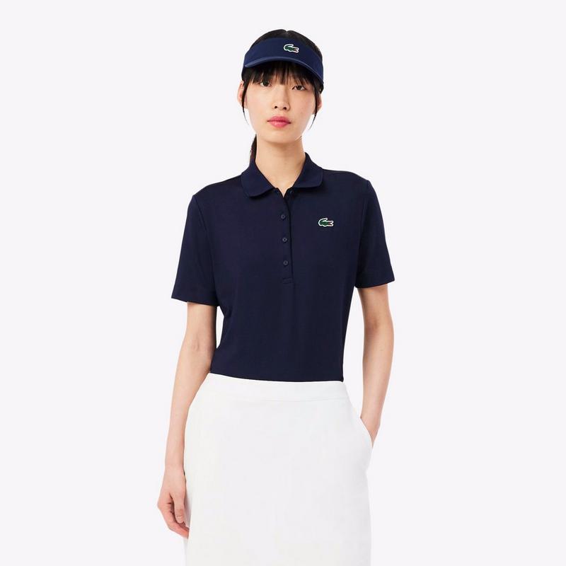 Lacoste Polo de golf extensible &agrave; coupe ajust&eacute;e UV Protect pour femmes