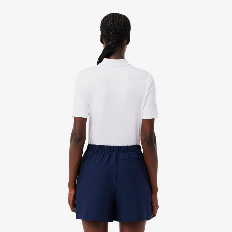 Lacoste Polo de golf extensible &agrave; coupe ajust&eacute;e UV Protect pour femmes