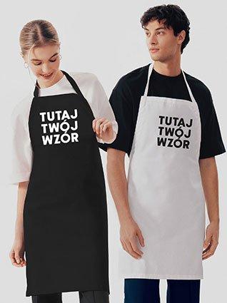 Kobieta i mężczyzna noszą czarno-białe fartuchy z napisem „Twój wzór tutaj”.